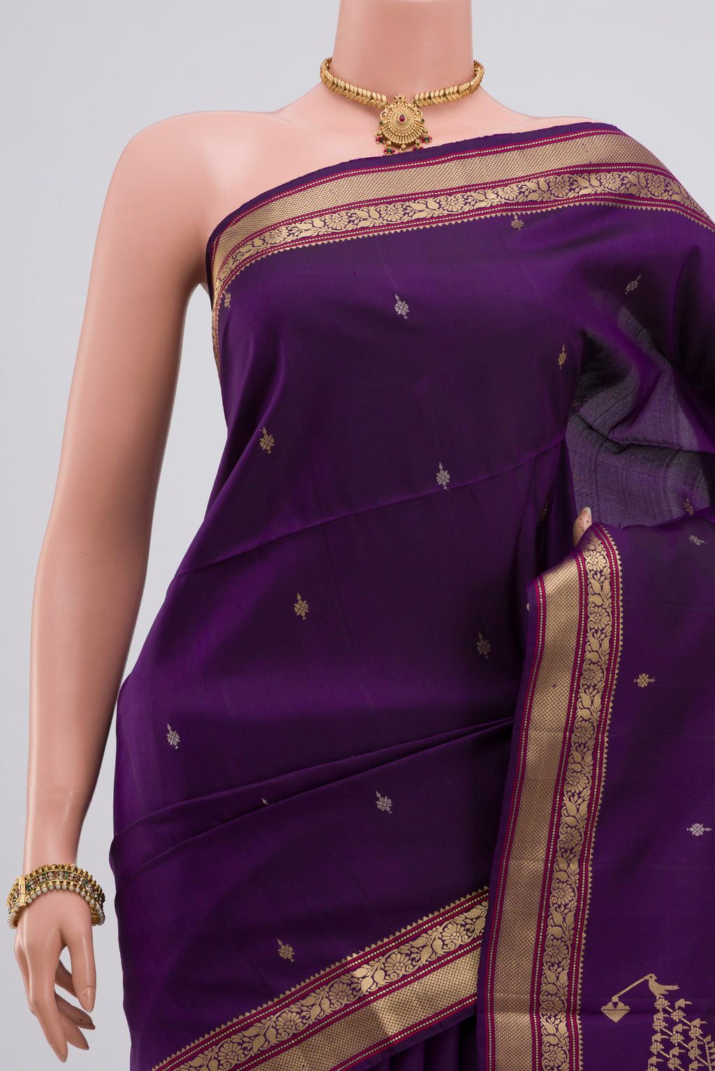 Border image of Purple Soft Silk Saree with Zari Butta on the body and Zari Border. 