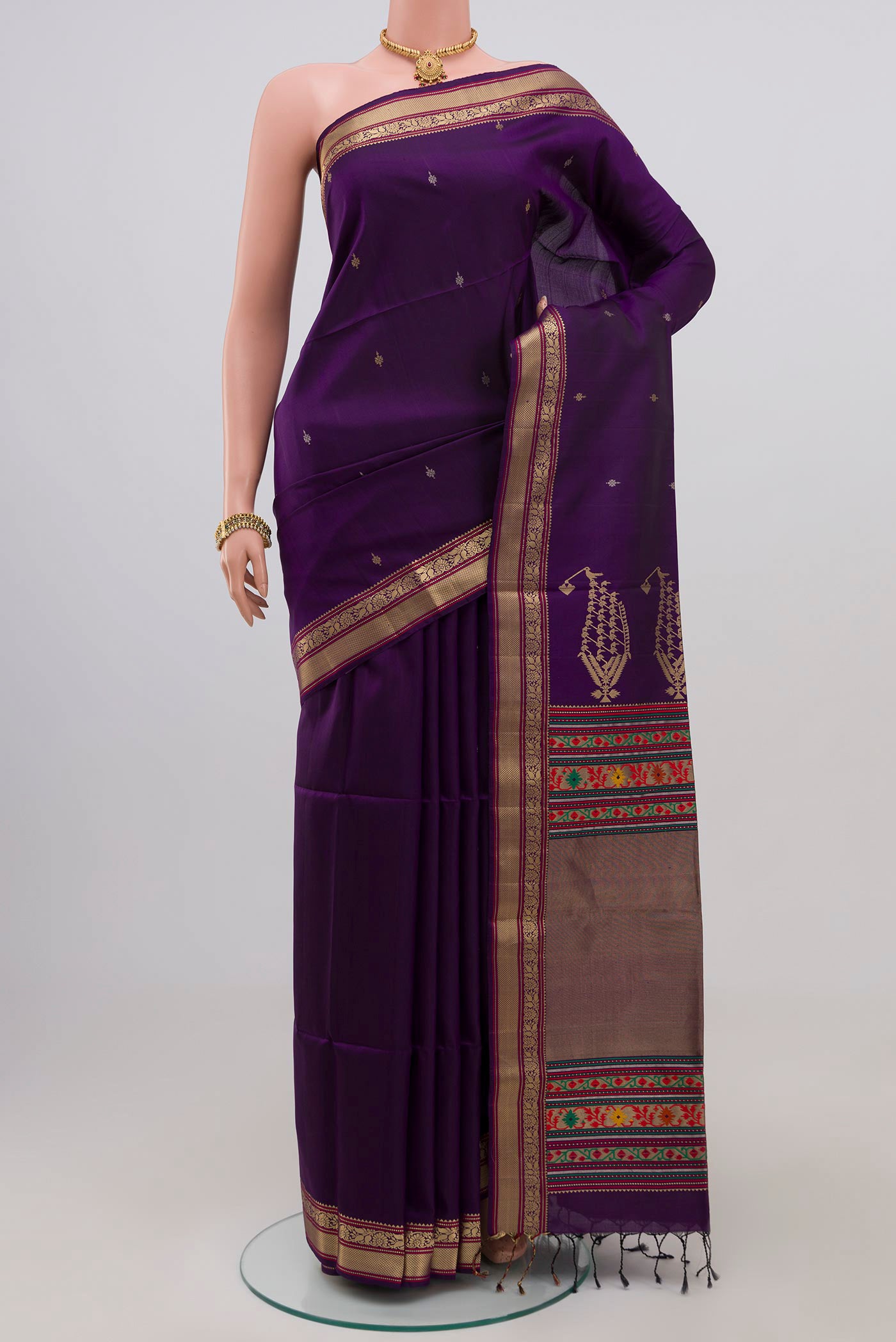 Purple Soft Silk Saree with Zari Butta on the body and Zari Border.  displayed on a mannequin