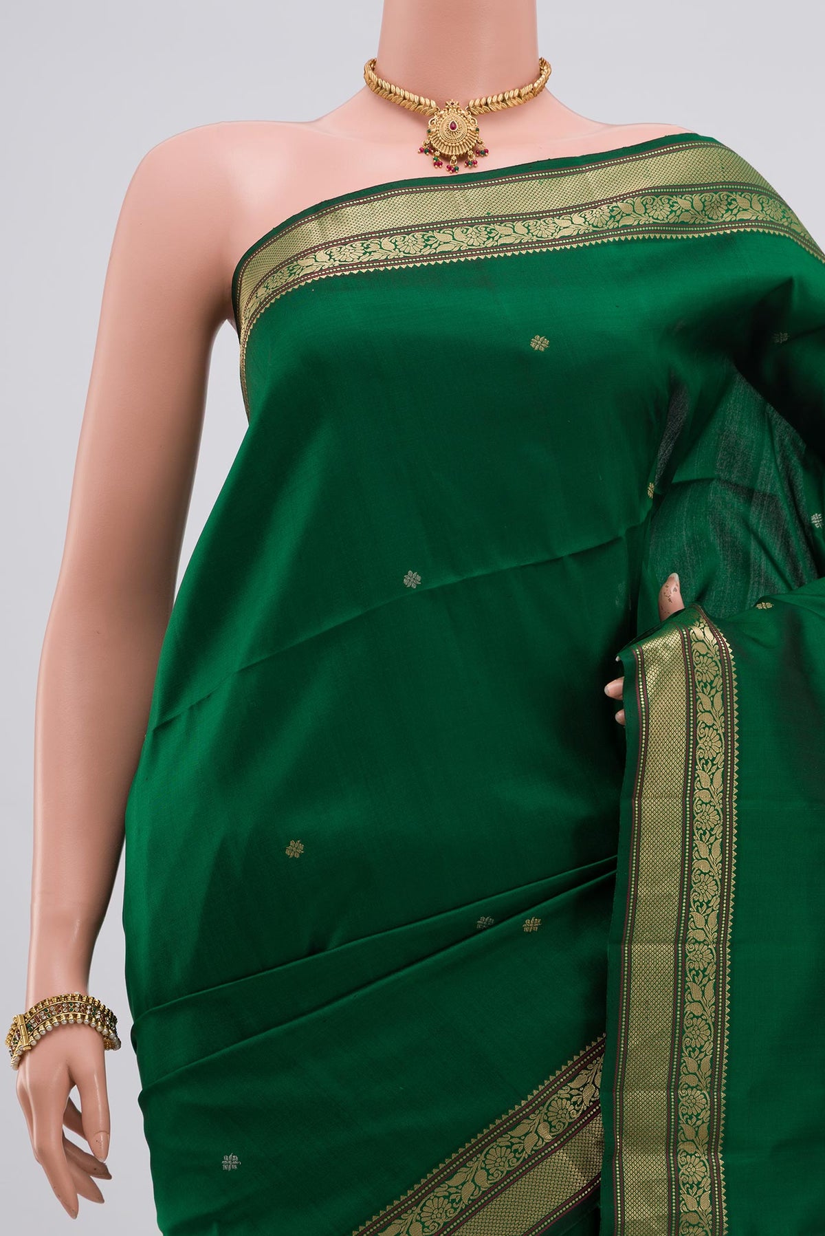 Border image of Green Soft Silk Saree with Zari Butta on the body and Zari Border. 