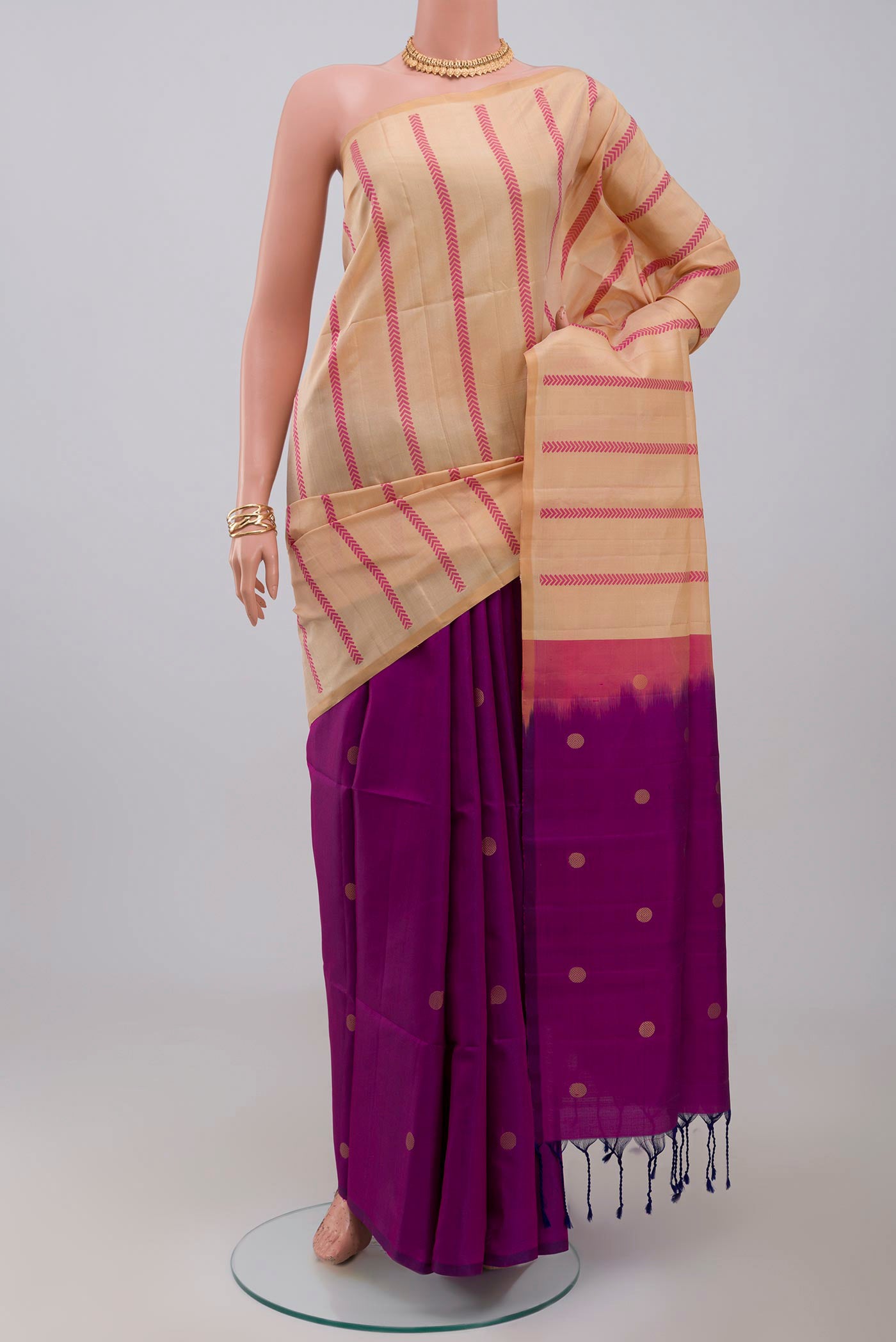 Cream Soft Silk Saree with Fancy on the body and Without Border.  displayed on a mannequin