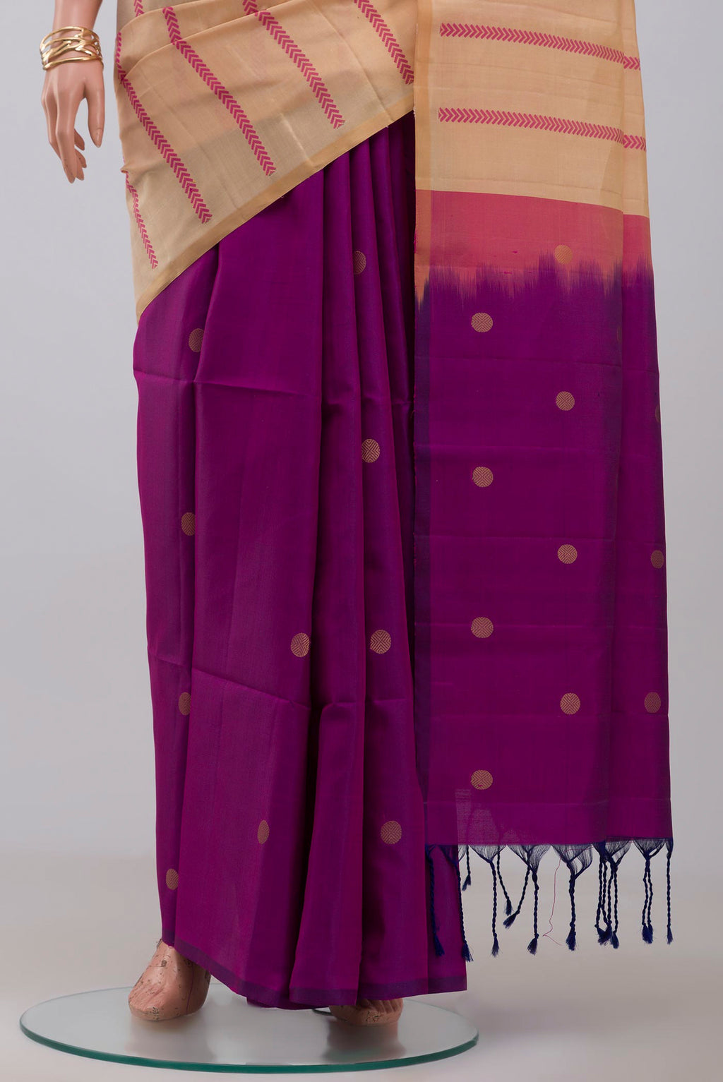 Pleats and pallu of Cream Soft Silk Saree with Fancy on the body and Without Border. 