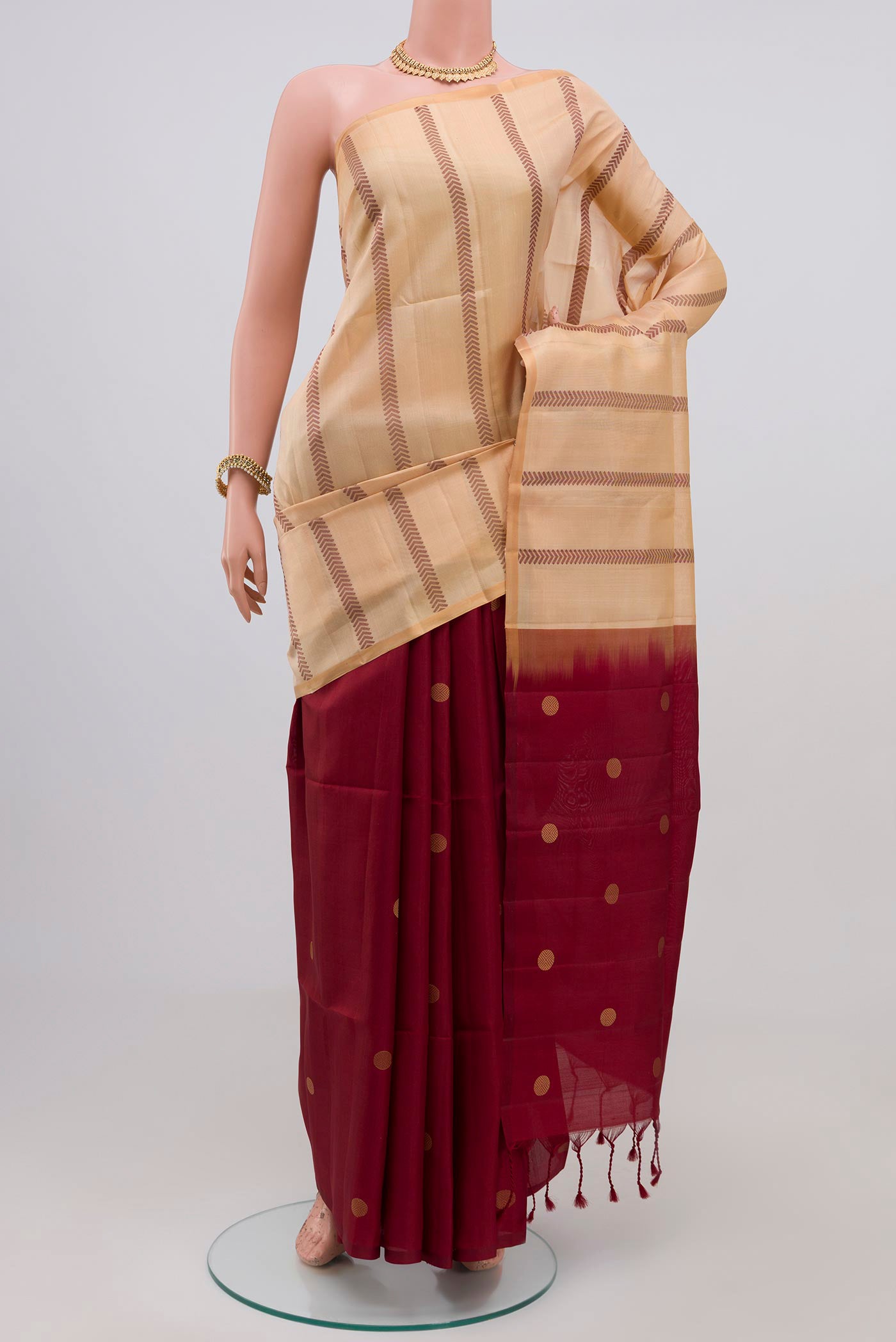 Cream Soft Silk Saree with Partli on the body and Without Border.  displayed on a mannequin