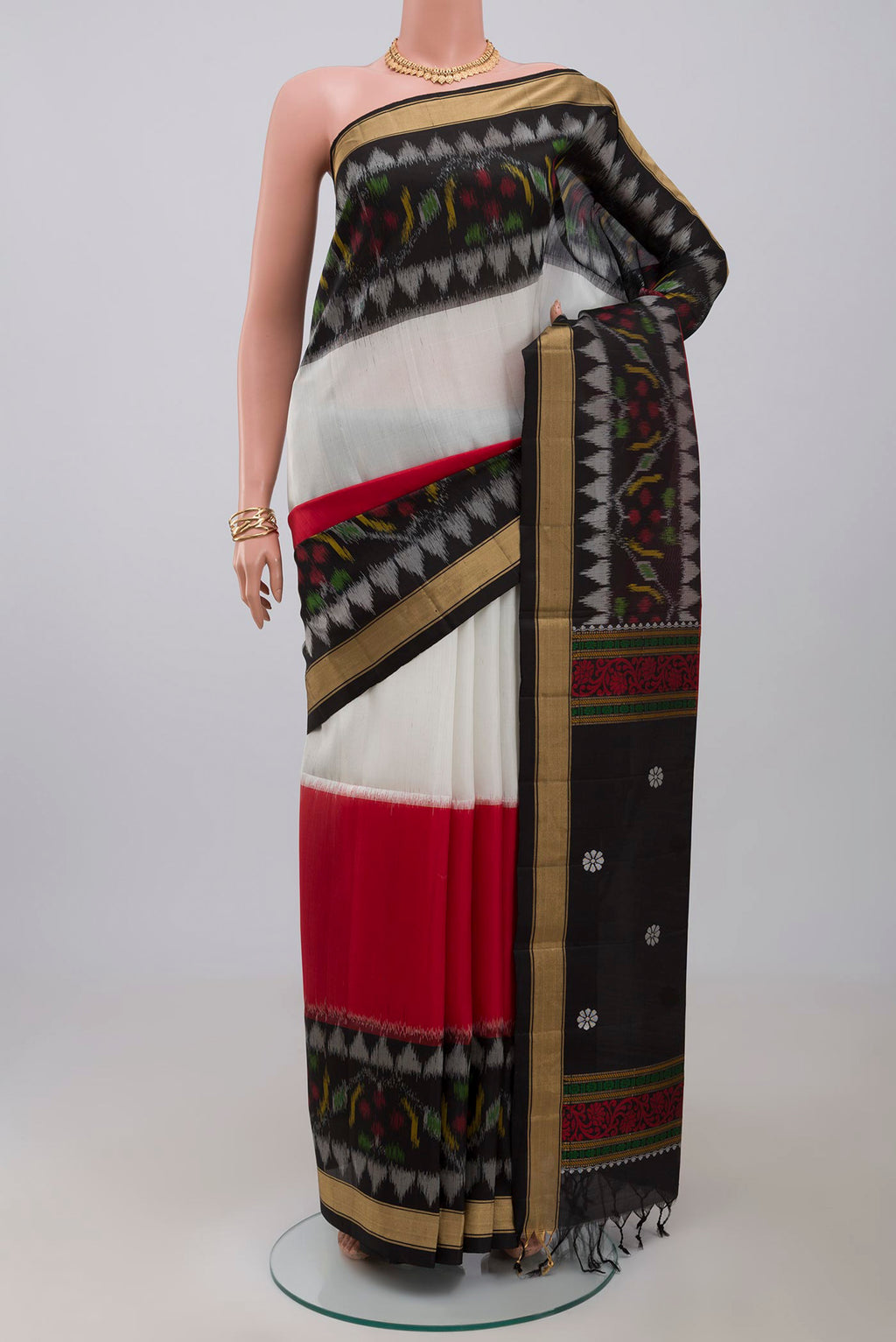 Multi Color Soft Silk Saree with Plain Body and Zari Border.  displayed on a mannequin