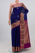 Blue Kanchipuram Saree with Zari Butta on the body and Zari Border.  displayed on a mannequin