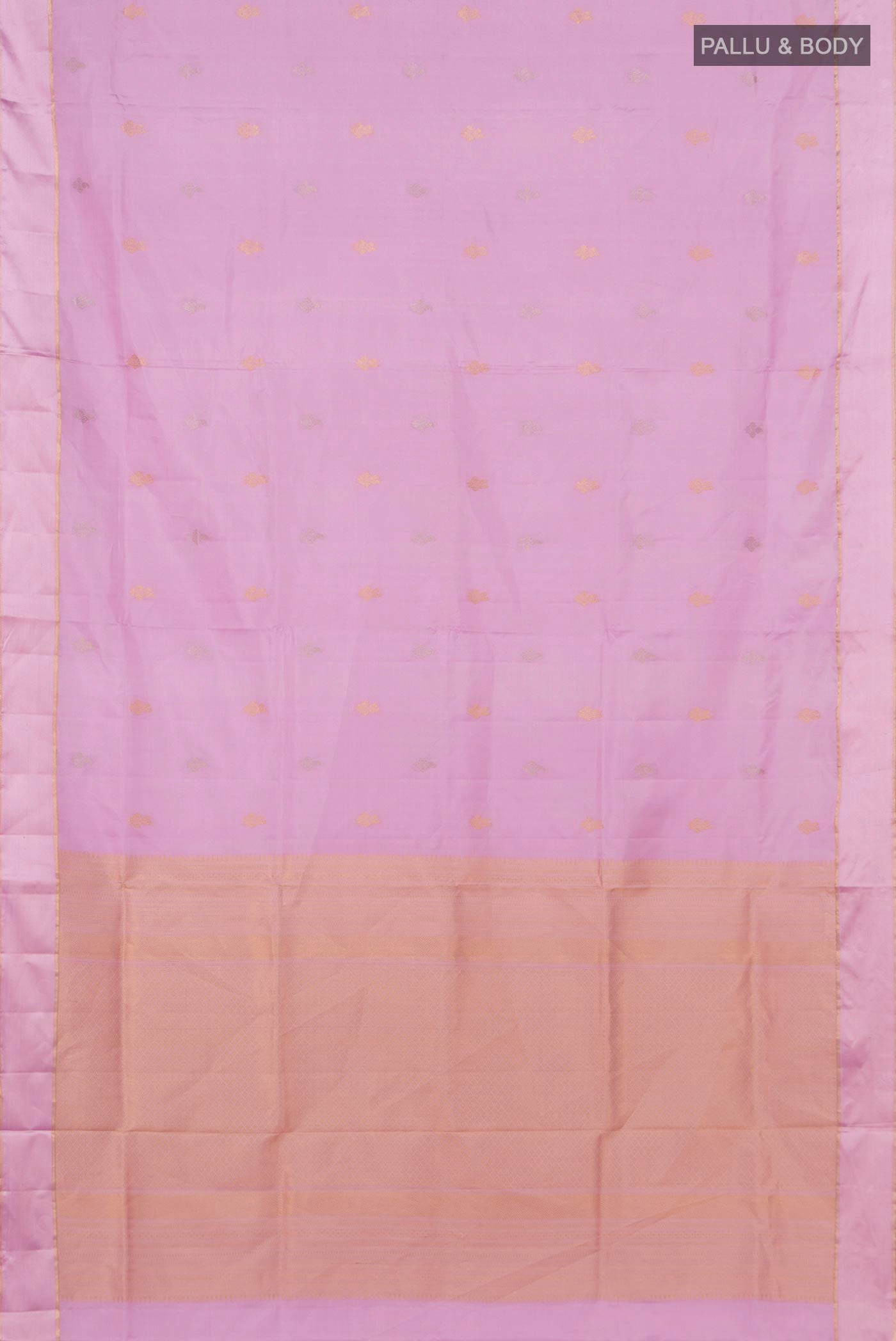 Flat view of Lavender Soft Silk Saree with Zari Butta on the body and Thin Zari Line. 