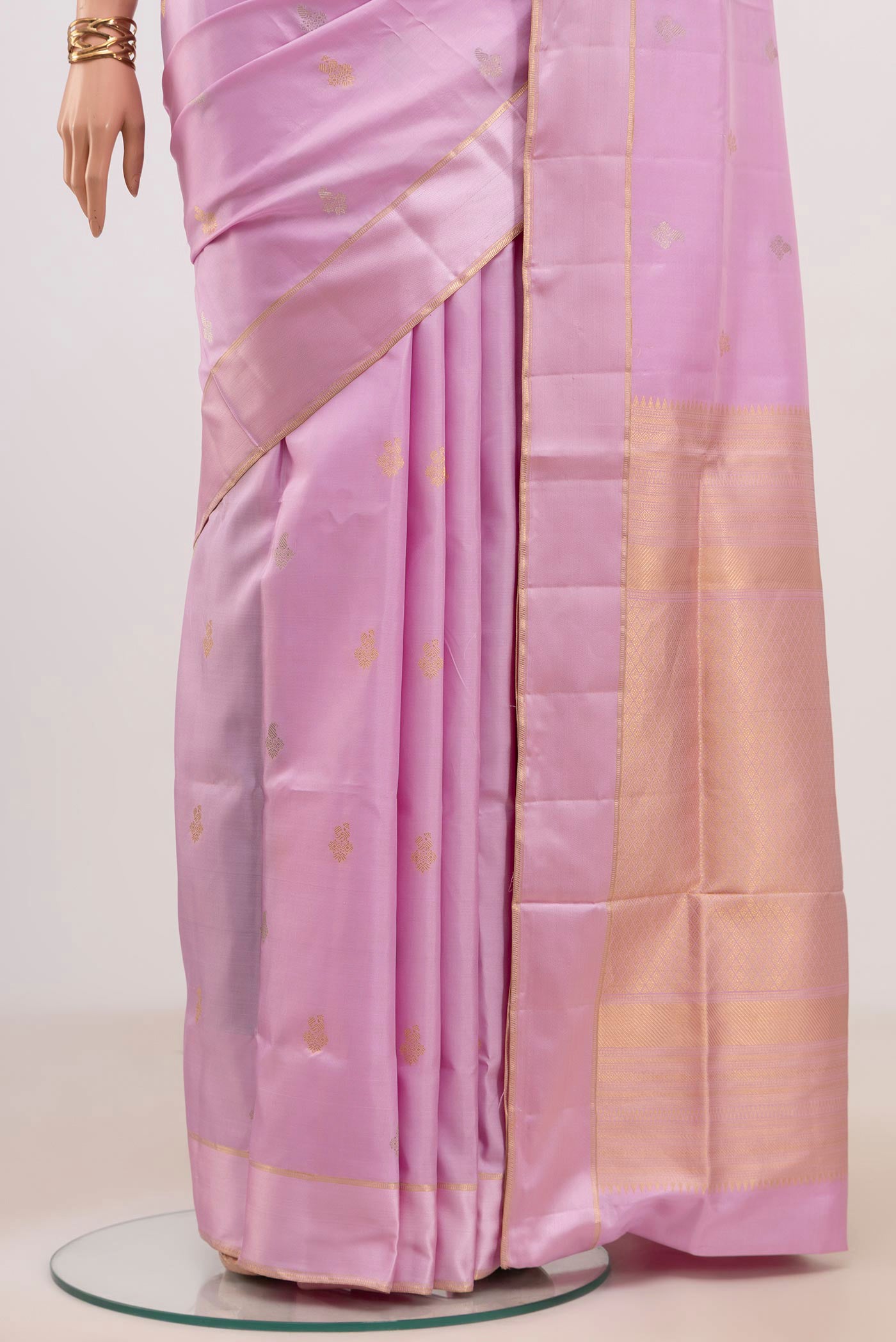 Pleats and pallu of Lavender Soft Silk Saree with Zari Butta on the body and Thin Zari Line. 