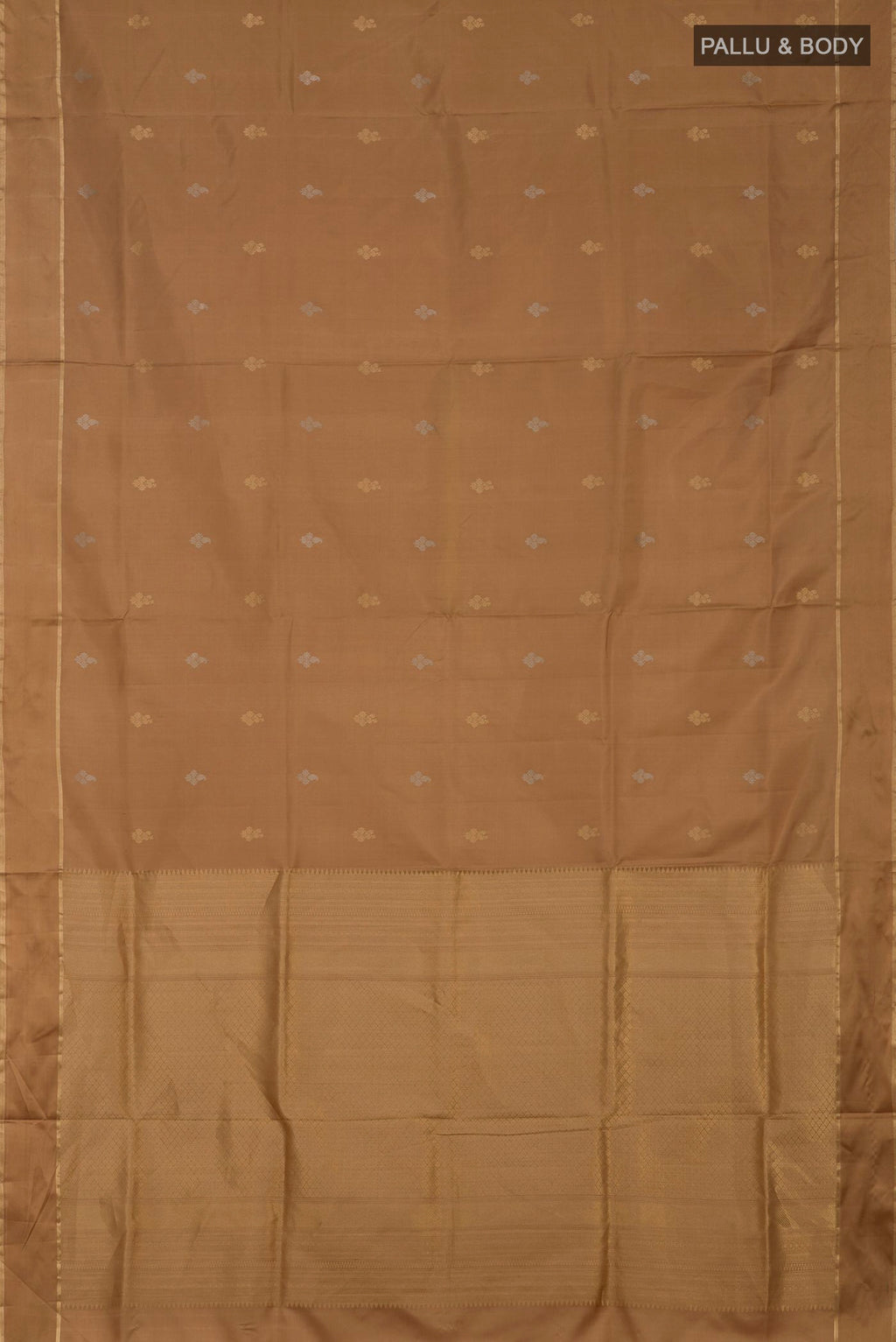 Flat view of Beige Soft Silk Saree with Zari Butta on the body and Thin Zari Line. 