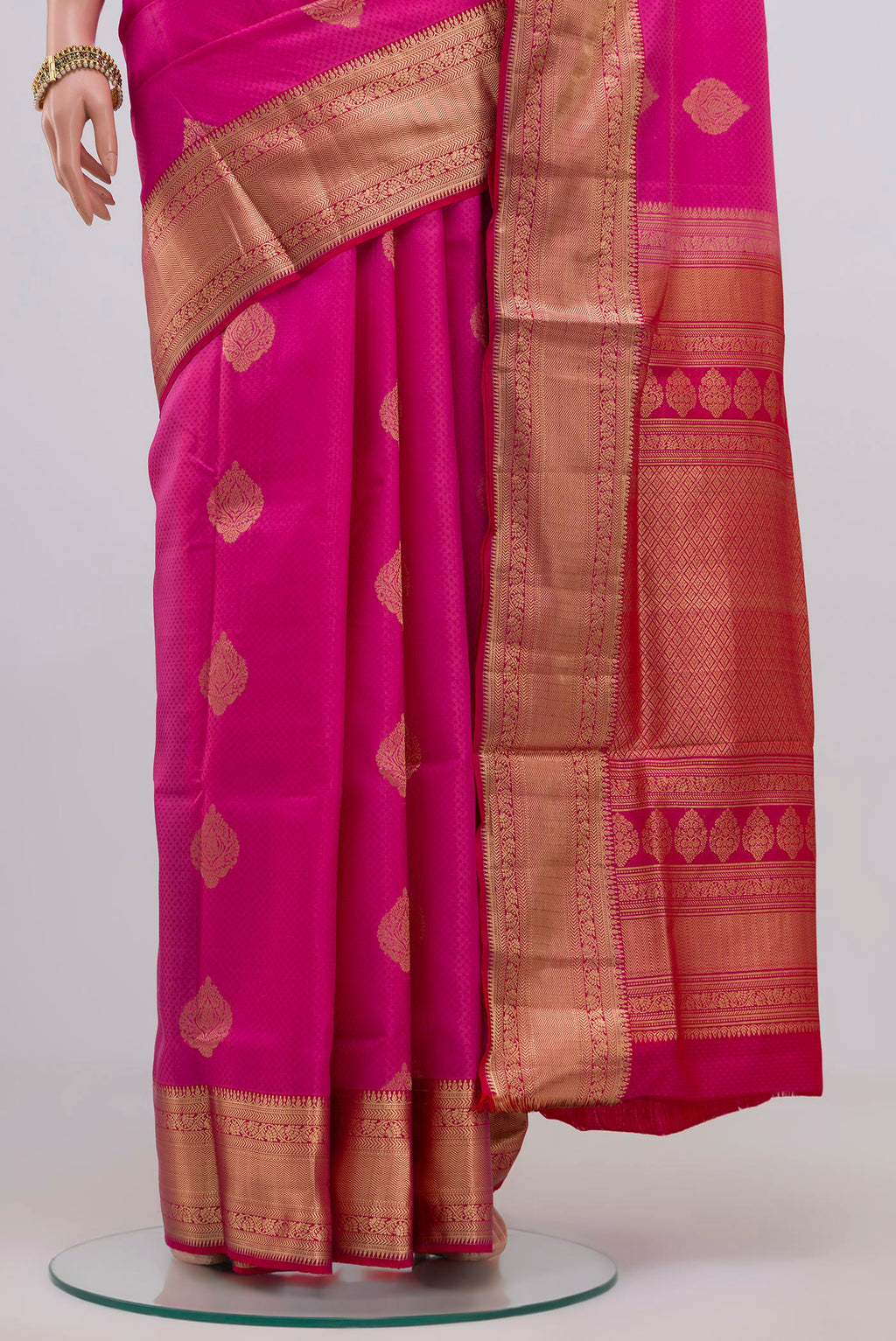 Pleats and pallu of Pink Soft Silk Saree with Jacquard With Zari Butta on the body and Zari Border. 