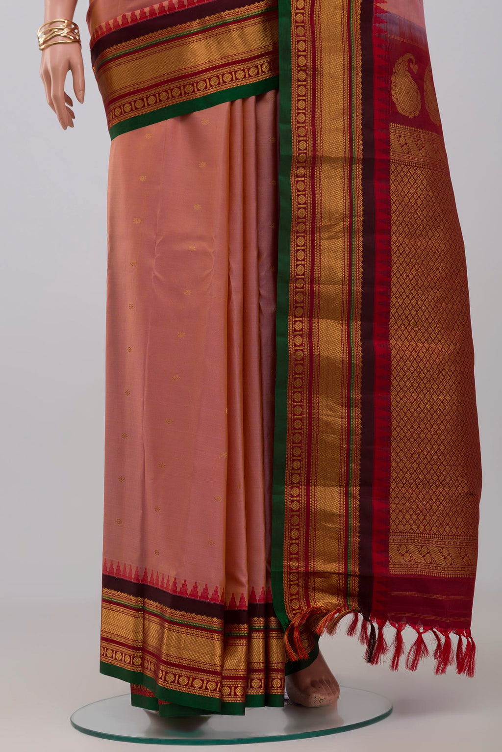 Pleats and pallu of Pink Gadwal Silk Saree with Zari Butta on the body and Zari Border. 