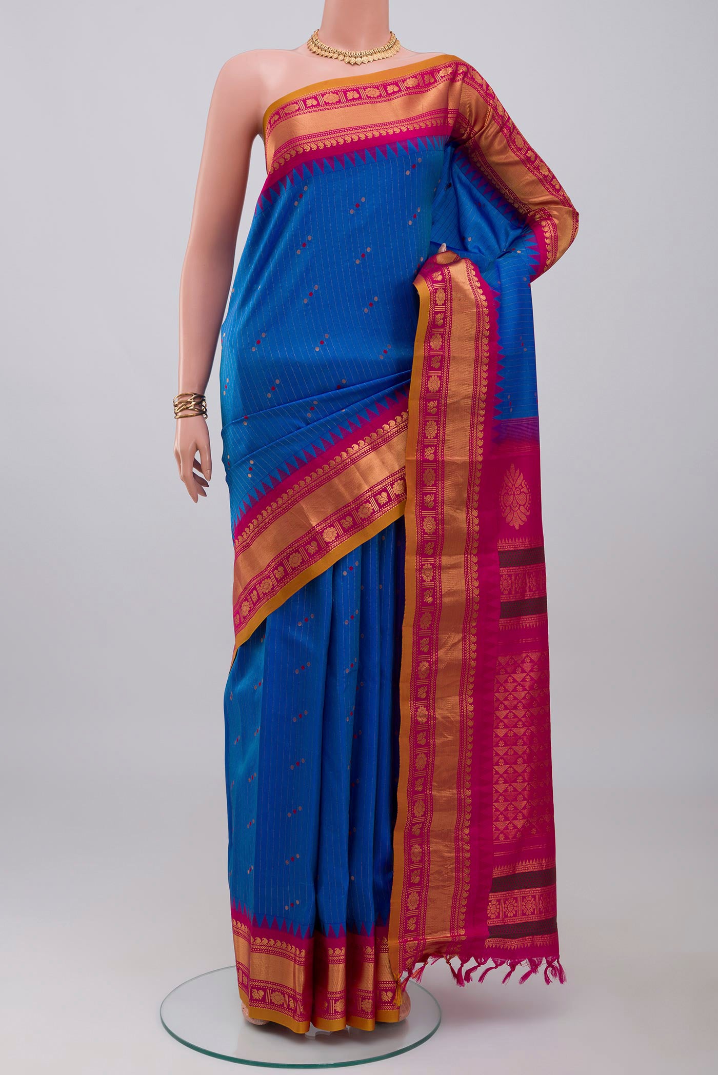 Blue Gadwal Silk Saree with Stripes on the body and Zari Border.  displayed on a mannequin