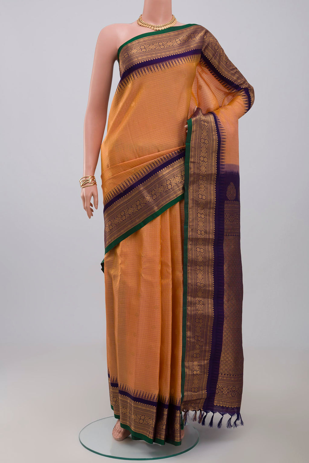 Peach Gadwal Silk Saree with Checked design on the body and Zari Border.  displayed on a mannequin