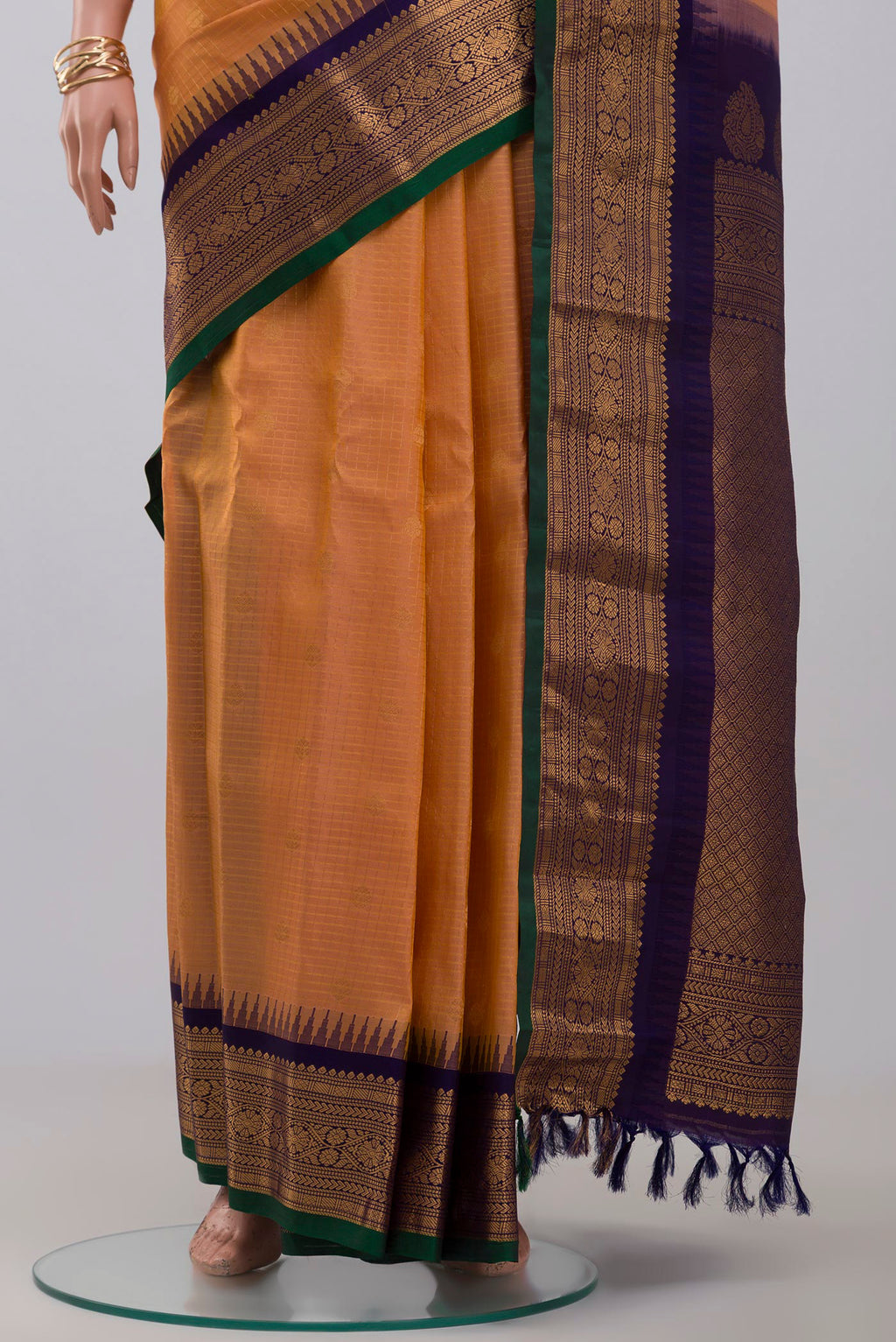 Pleats and pallu of Peach Gadwal Silk Saree with Checked design on the body and Zari Border. 