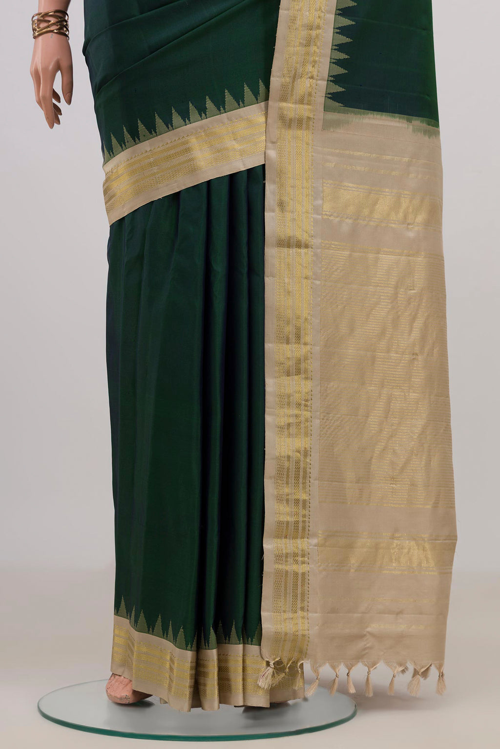 Pleats and pallu of Pure Silk Bottle Green Gadwal Saree with Plain Body and Zari Border. 
