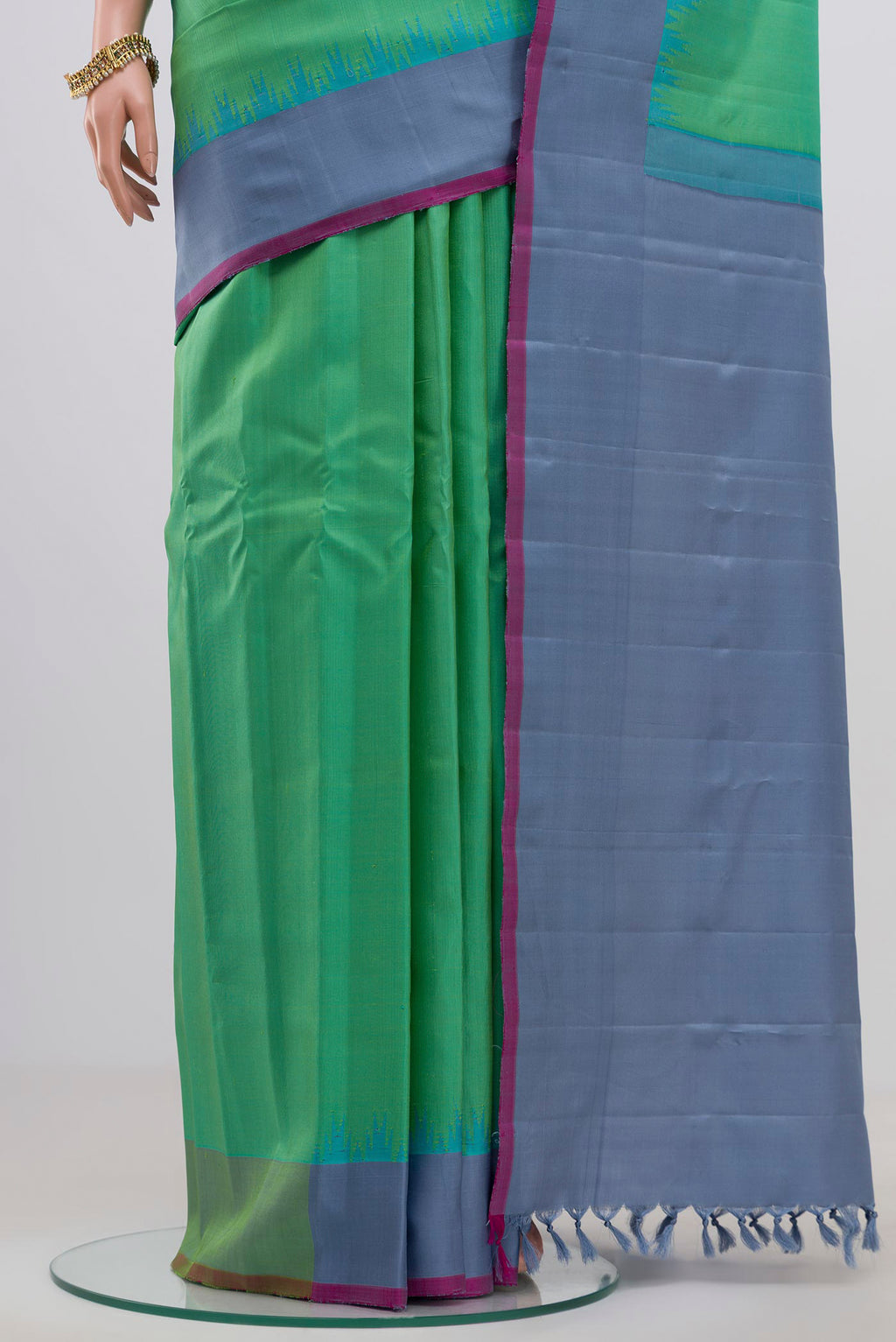 Pleats and pallu of Green Gadwal Silk Saree with Zari Butta on the body and Plain Border. 