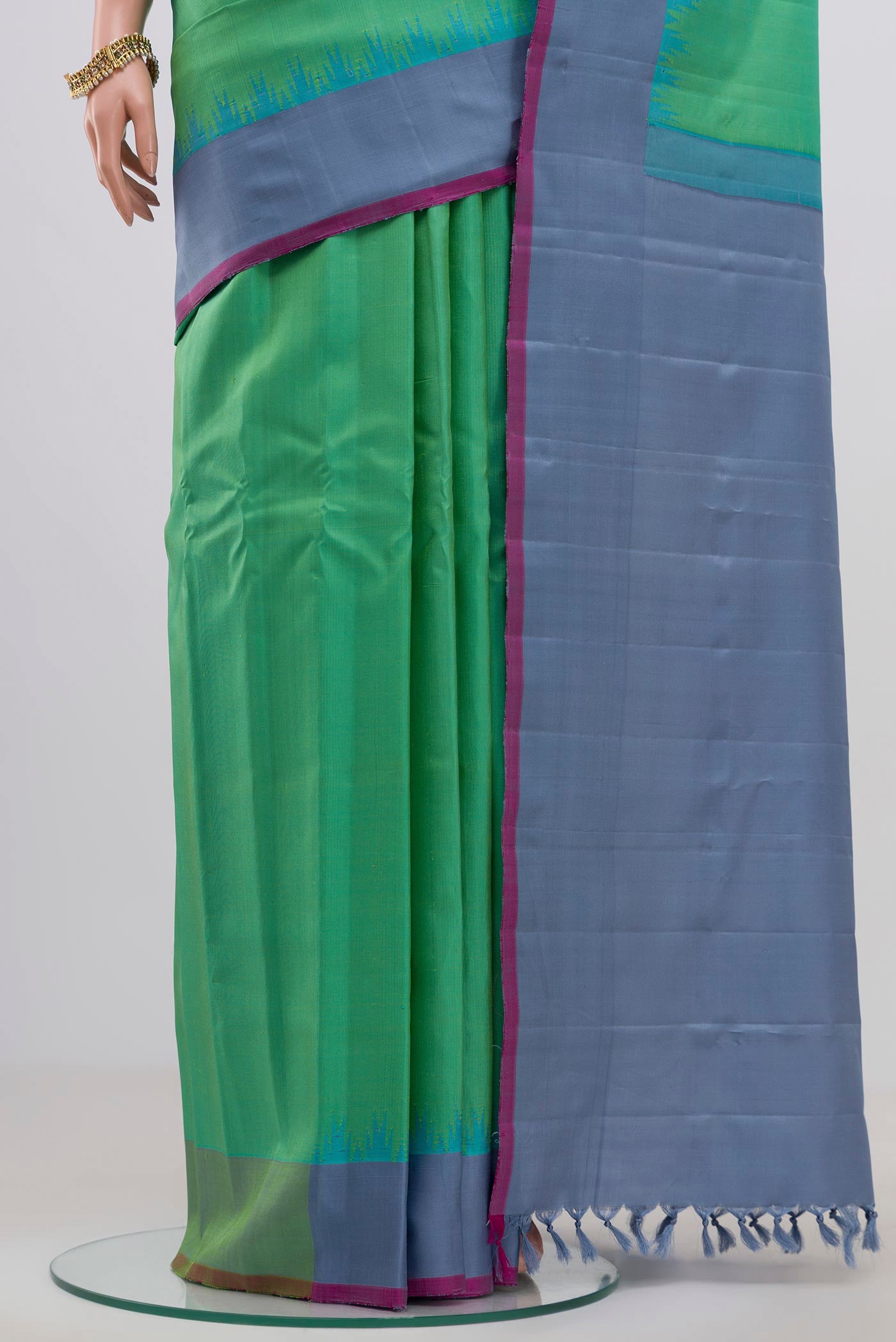 Pleats and pallu of Green Gadwal Silk Saree with Zari Butta on the body and Plain Border. 