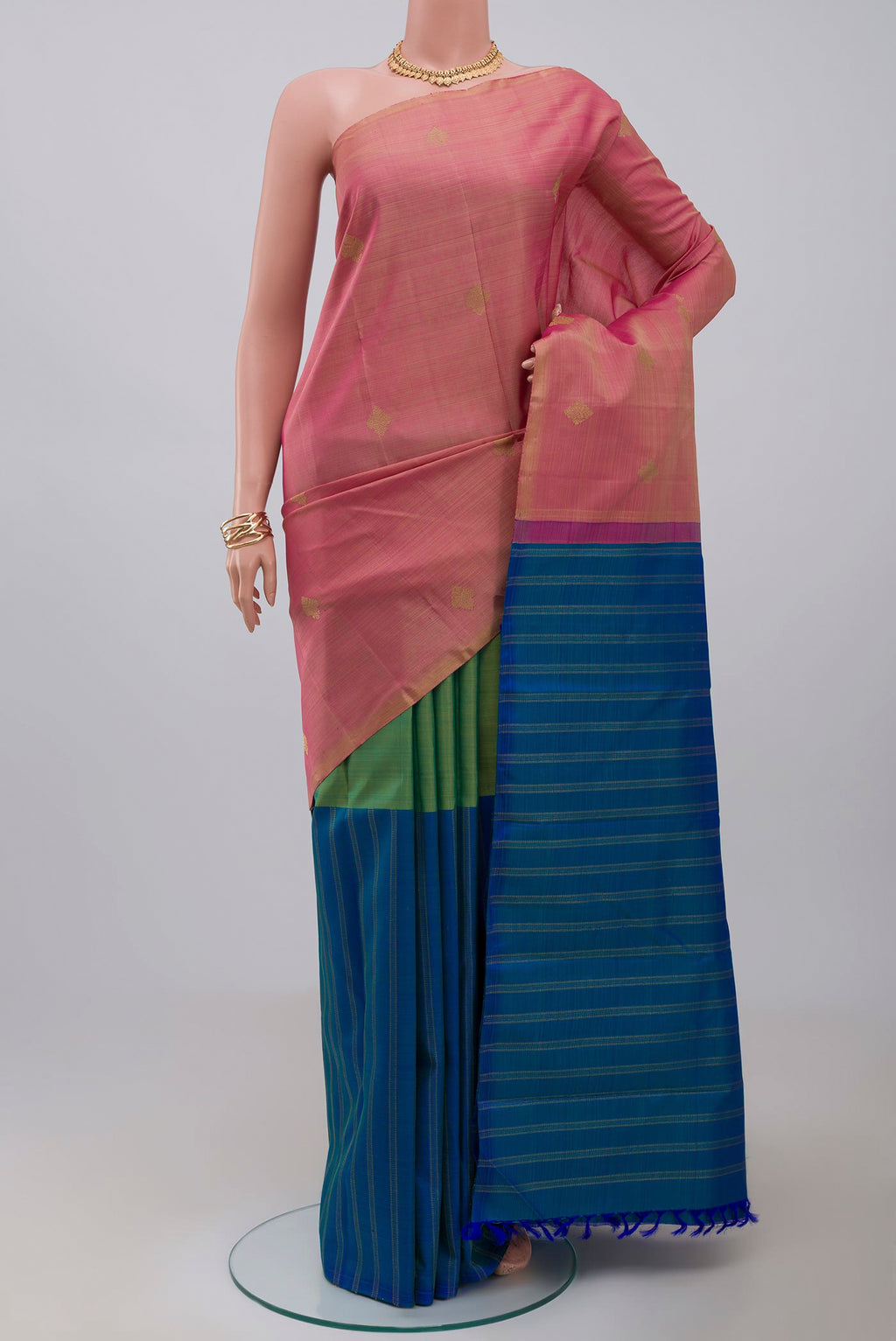 Pure Silk Pure Zari Pink Kanchipuram Saree with Partli on the body and Without Border.  displayed on a mannequin