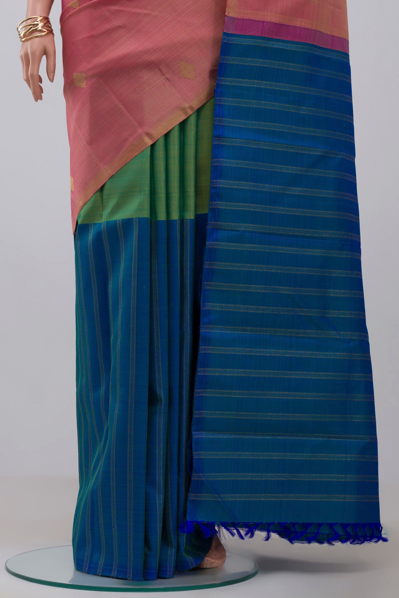 Pleats and pallu of Pure Silk Pure Zari Pink Kanchipuram Saree with Partli on the body and Without Border. 