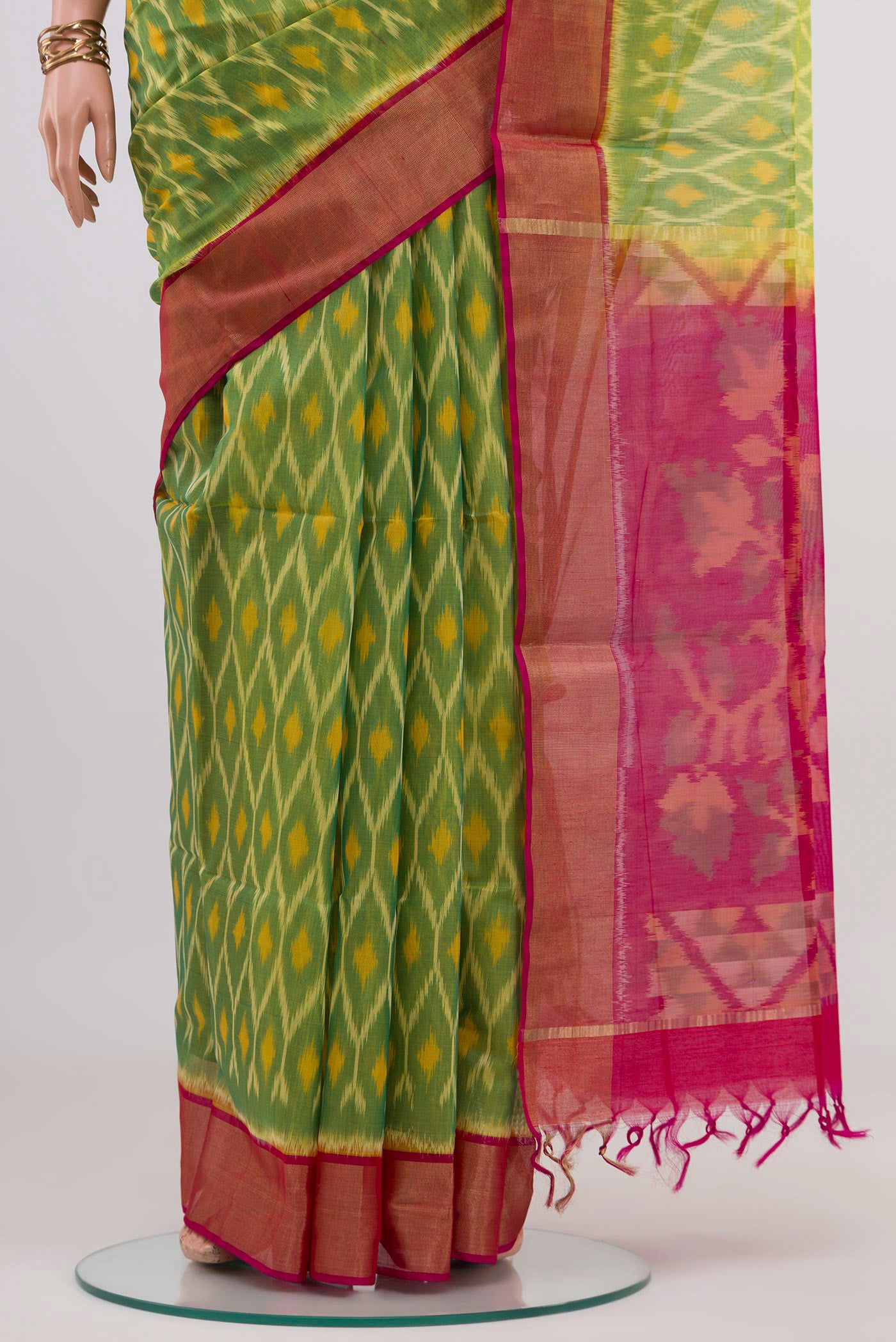 Pleats and pallu of Light Green Silk Cotton Saree with Ikat design on the body and Zari Border. 