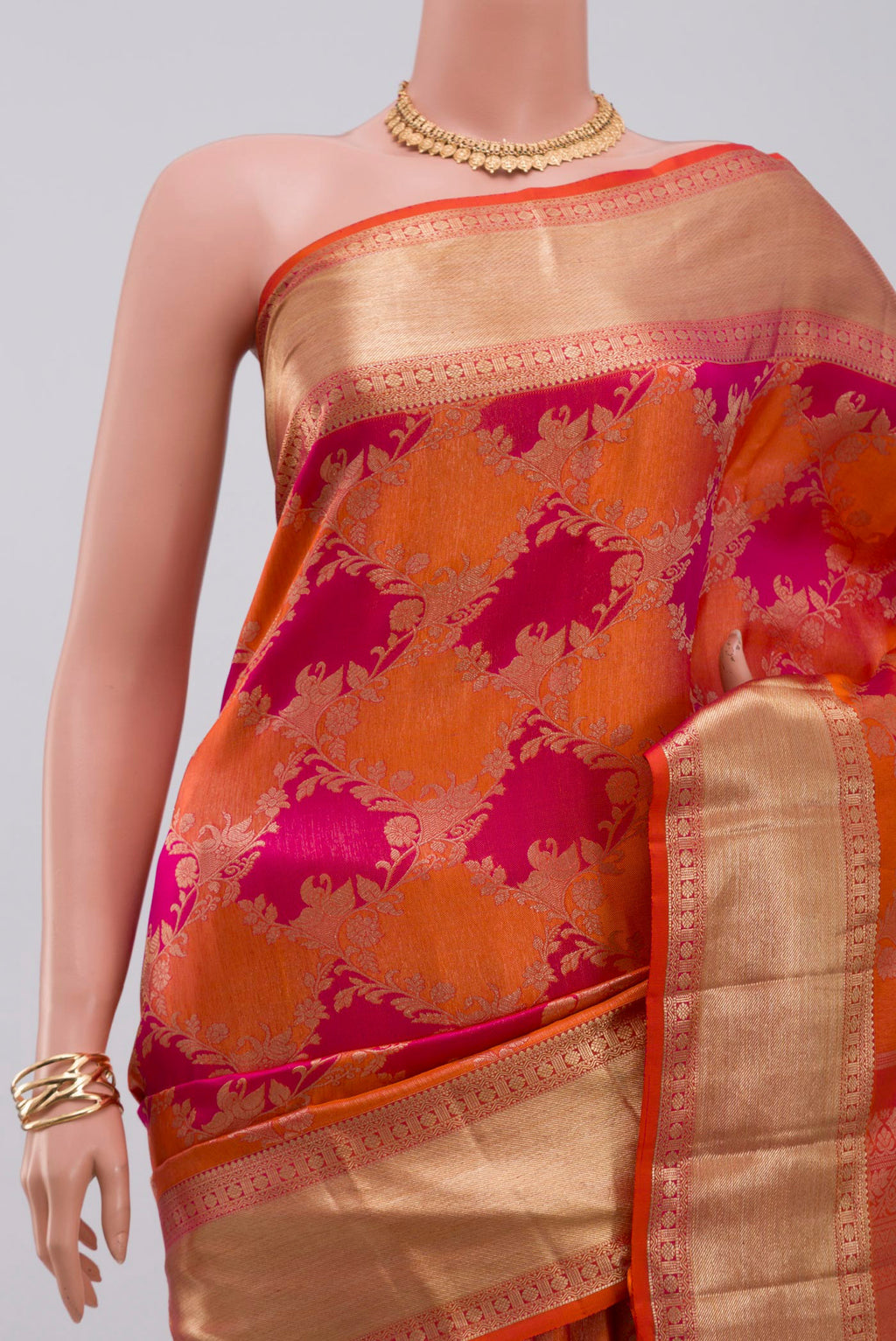 Border image of Orange Kanjivaram Saree with Zari Brocade on the body and Zari Border. 