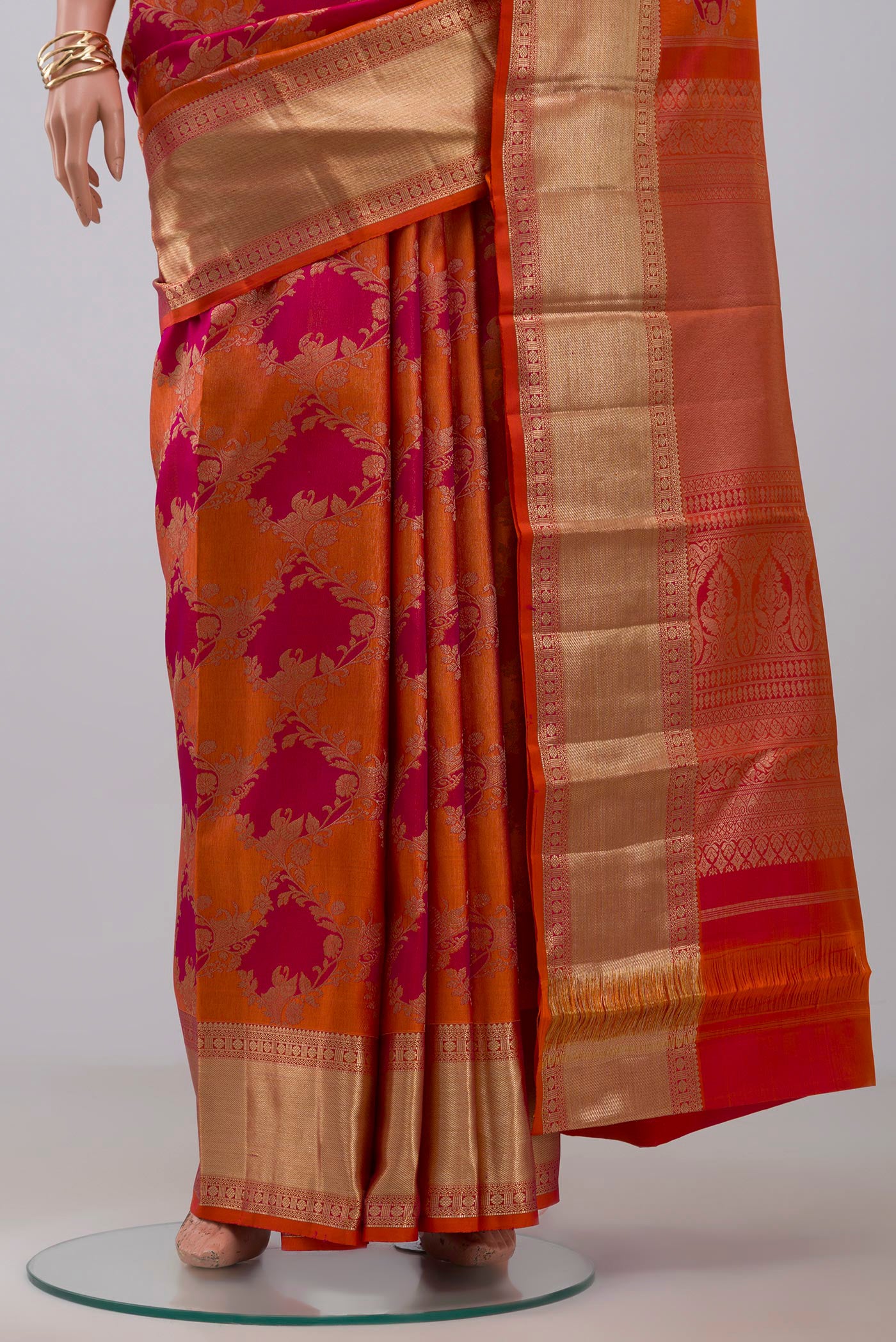 Pleats and pallu of Orange Kanjivaram Saree with Zari Brocade on the body and Zari Border. 