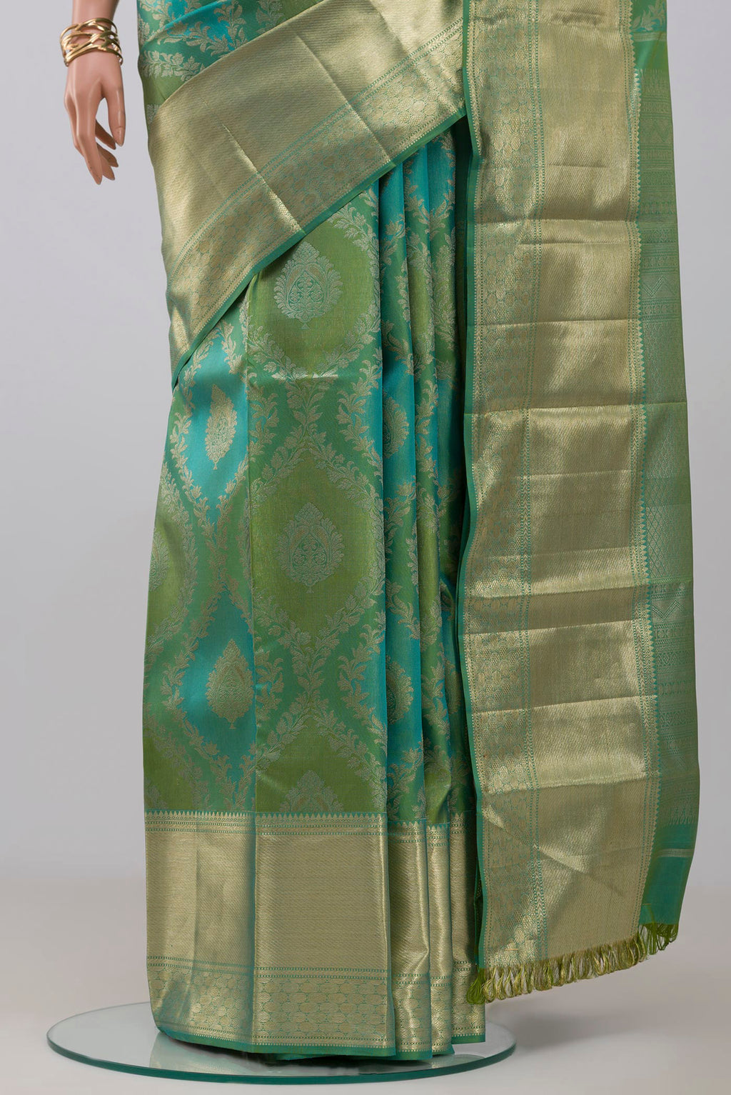 Pleats and pallu of Green Kanjivaram Silk Saree with Zari Brocade on the body and Zari Border. 