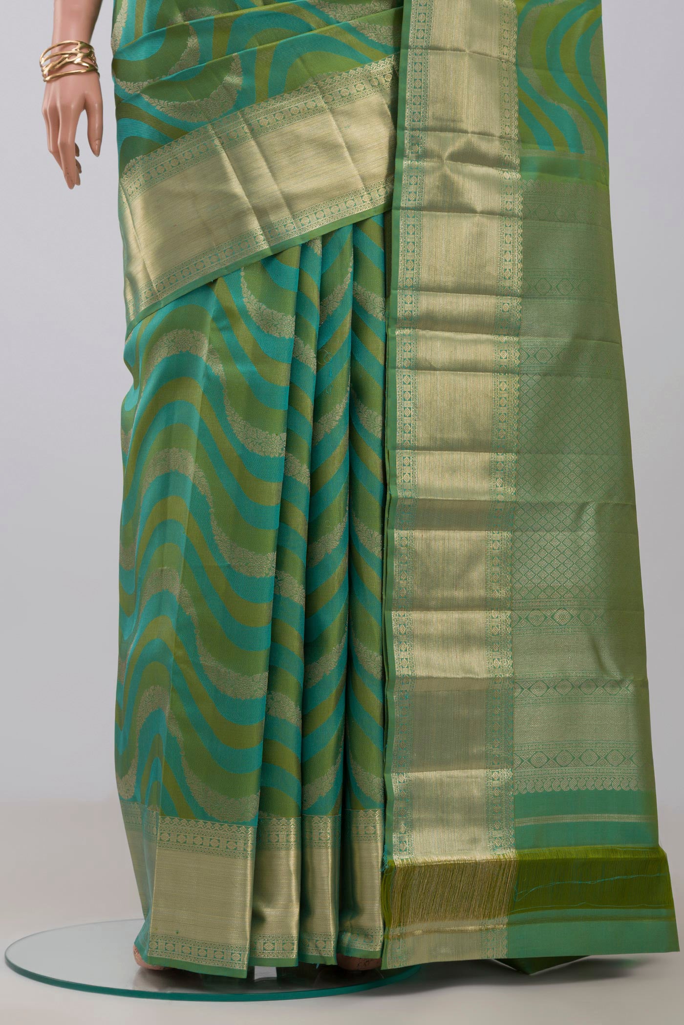 Pleats and pallu of Green Kanjivaram Silk Saree with Zari Brocade on the body and Zari Border. 