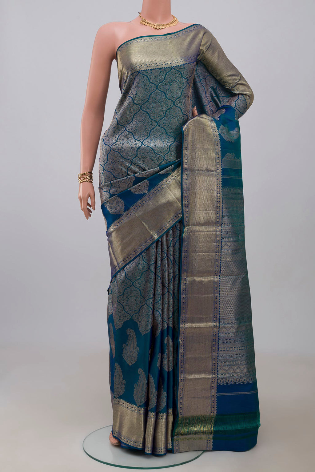 Blue Kanjivaram Silk Saree with Zari Brocade on the body and Zari Border.  displayed on a mannequin