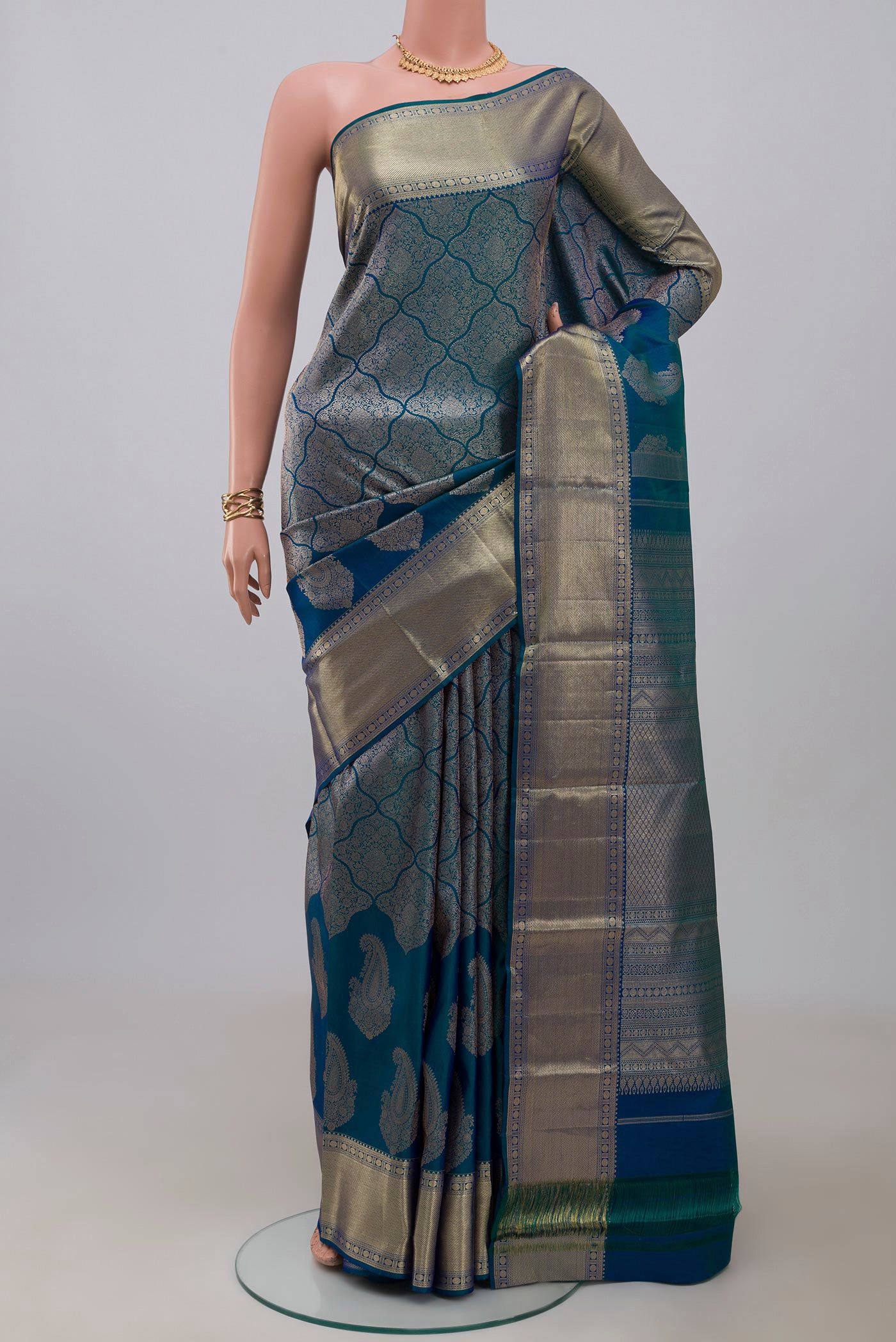 Blue Kanjivaram Silk Saree with Zari Brocade on the body and Zari Border.  displayed on a mannequin