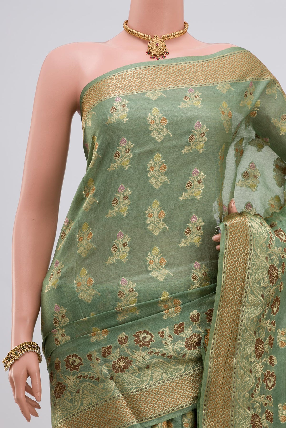 Border image of Pista Green Tussar Silk Saree with Zari Butta on the body and Zari Border. 