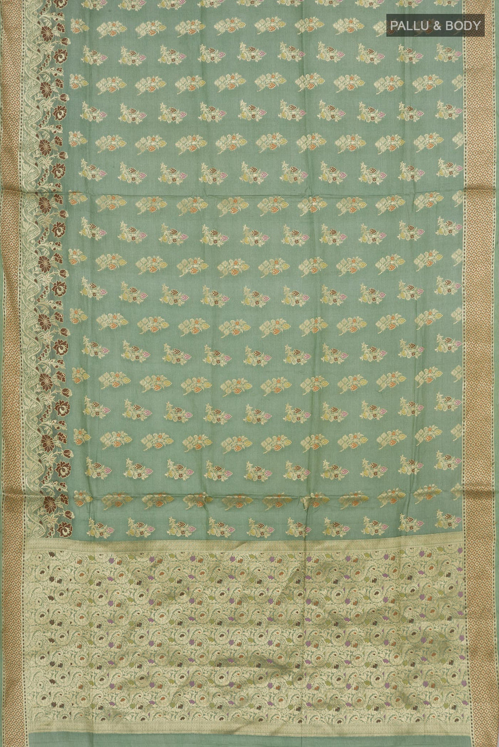 Flat view of Pista Green Tussar Silk Saree with Zari Butta on the body and Zari Border. 