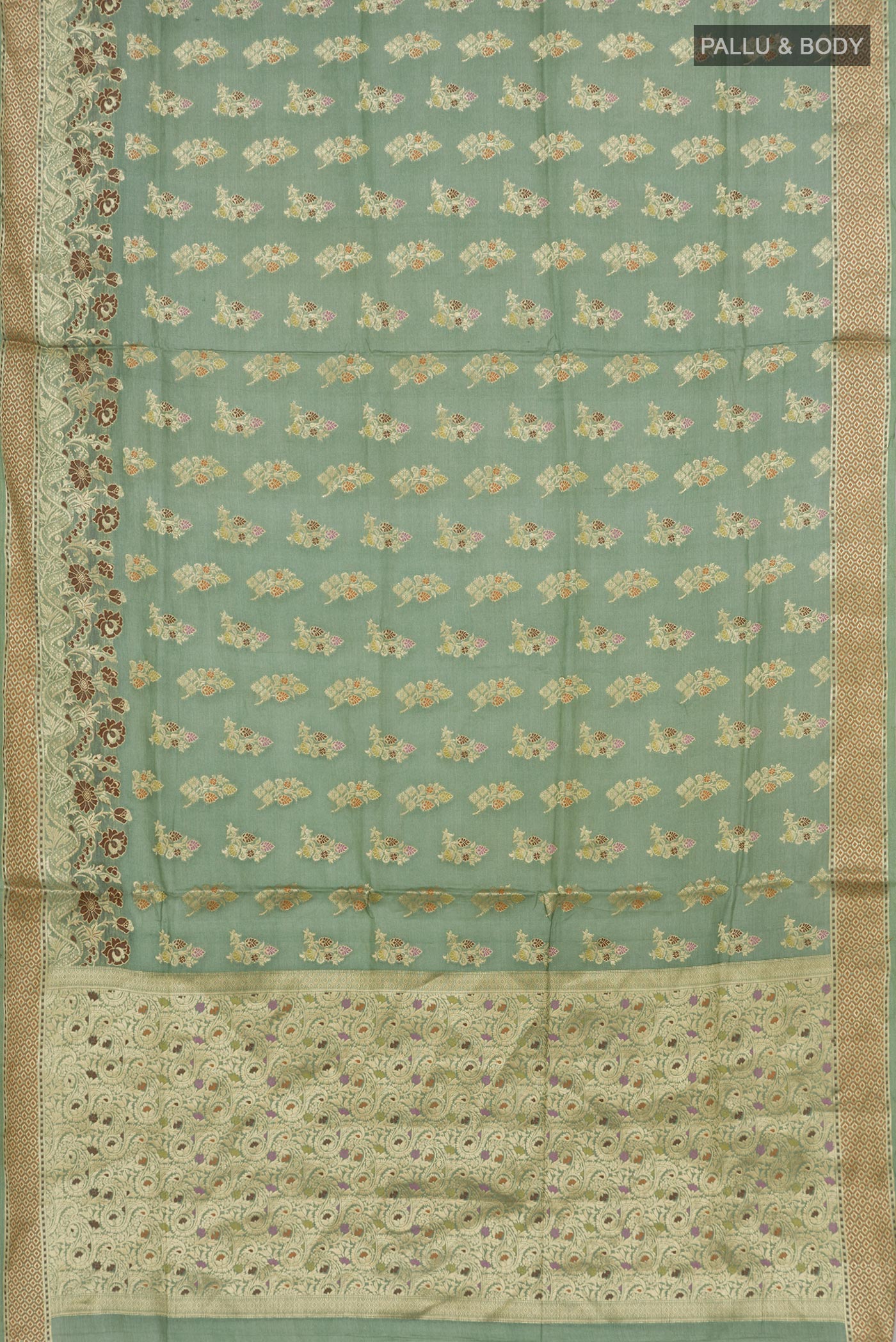 Flat view of Pista Green Tussar Silk Saree with Zari Butta on the body and Zari Border. 