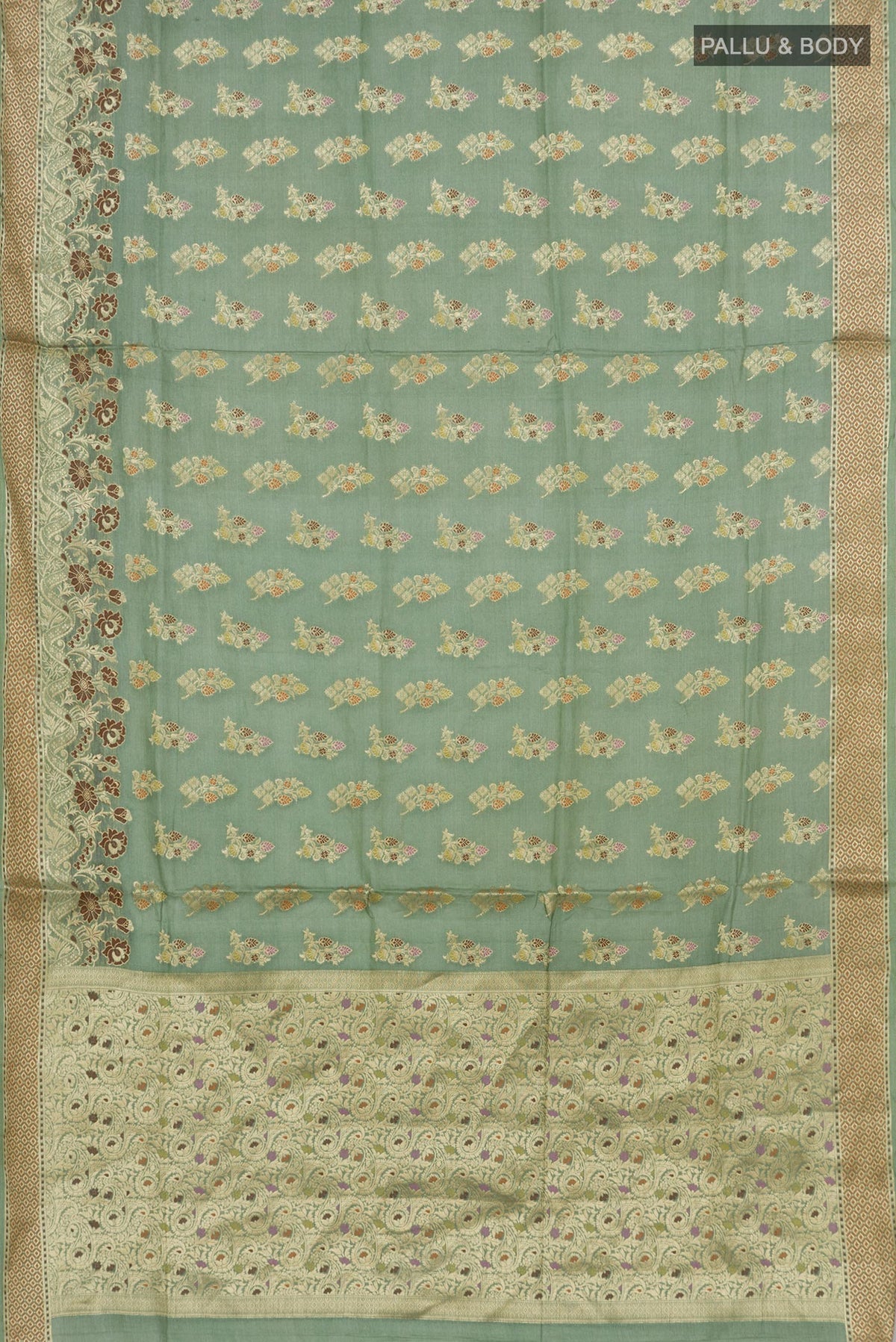 Flat view of Pista Green Tussar Silk Saree with Zari Butta on the body and Zari Border. 