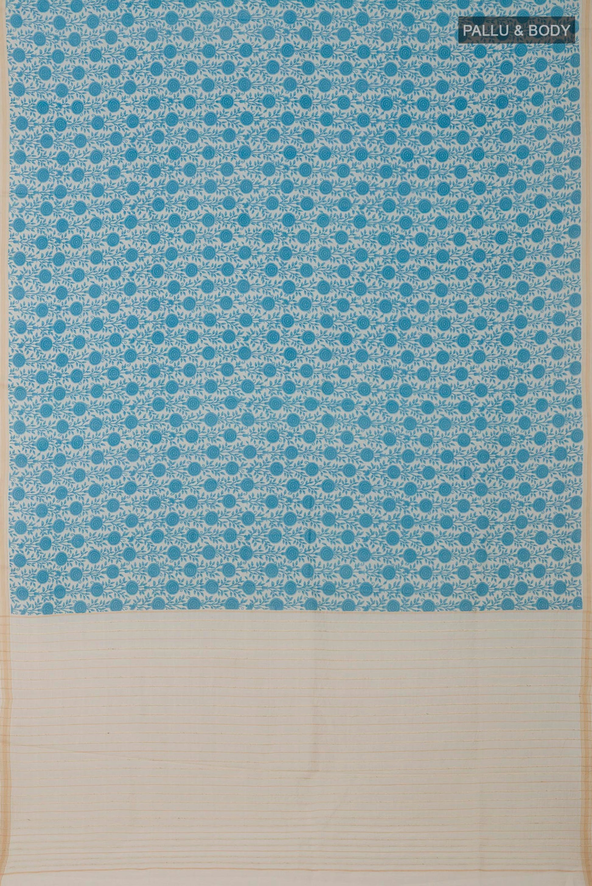 Flat view of Cream Tussar Saree with Printed design on the body and Thin Zari Line. 