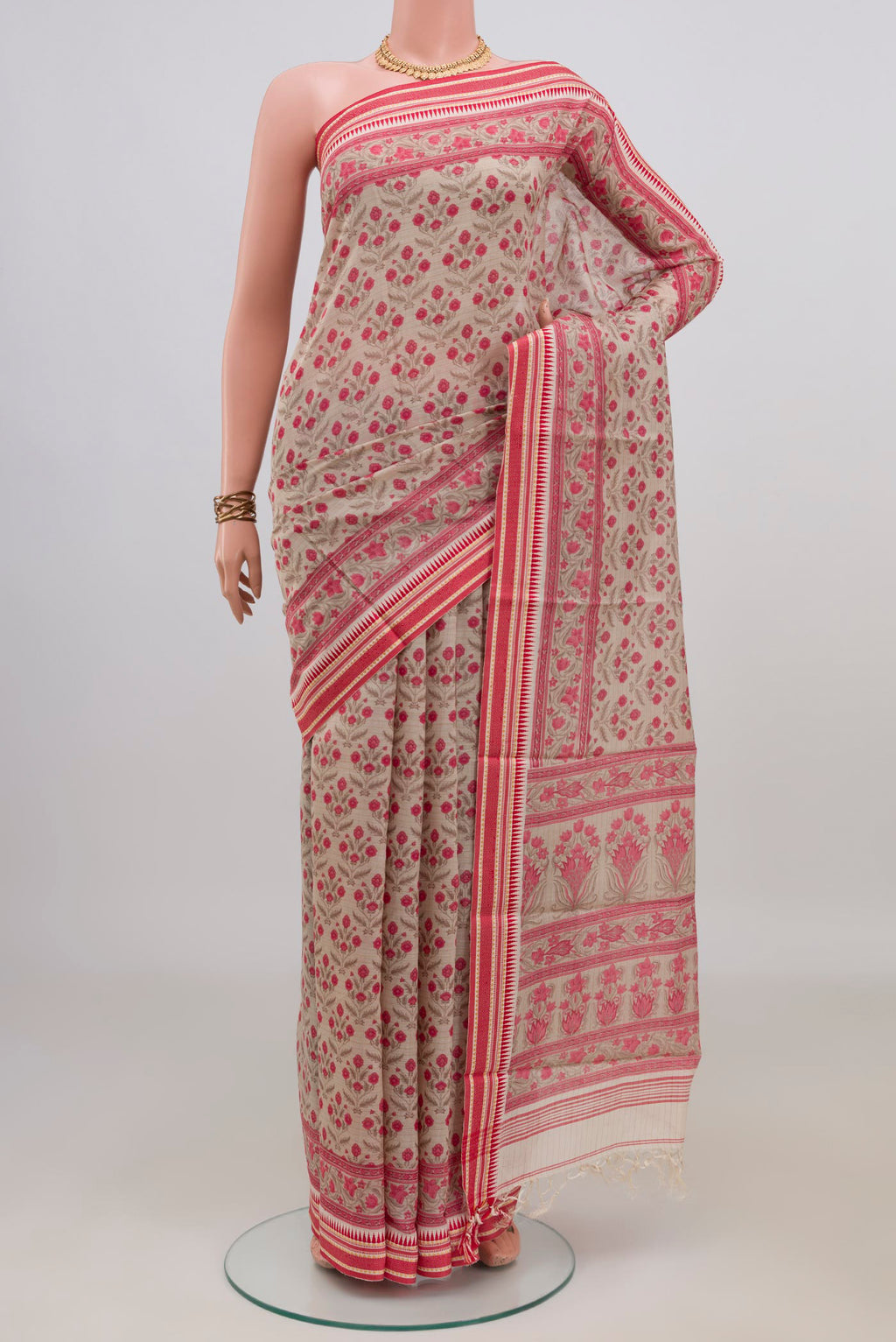 Beige Tussar Saree with Floral Print on the body and Thread Border.  displayed on a mannequin