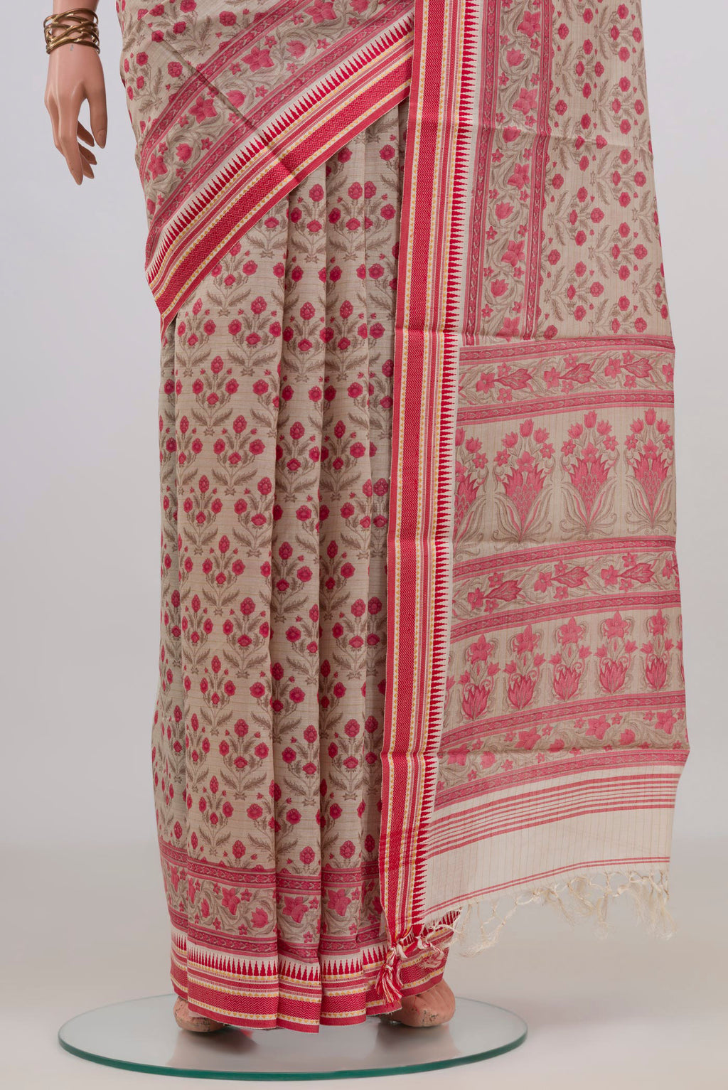 Pleats and pallu of Beige Tussar Saree with Floral Print on the body and Thread Border. 
