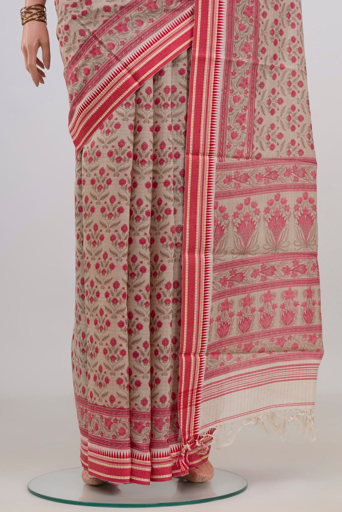 Pleats and pallu of Beige Tussar Saree with Floral Print on the body and Thread Border. 