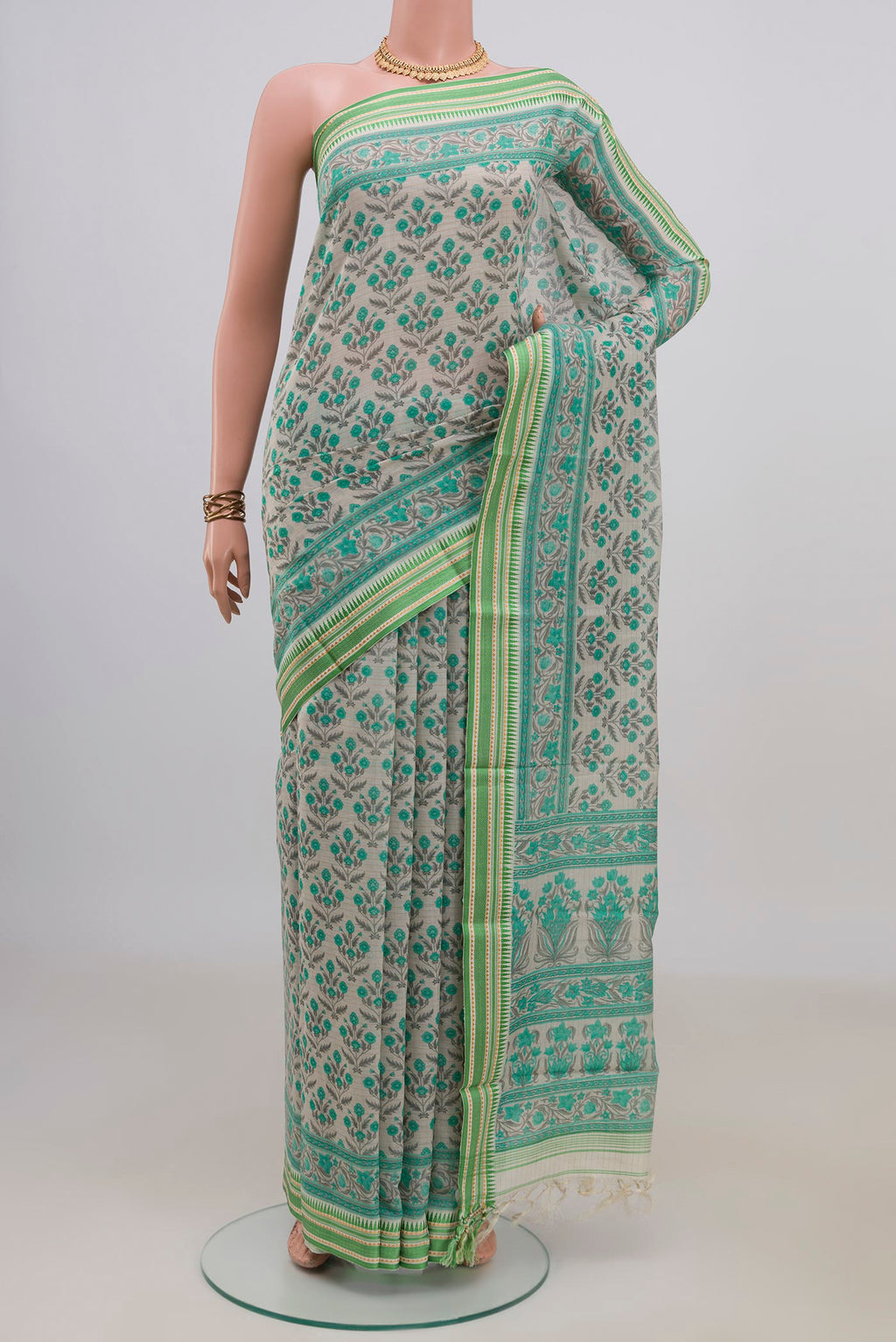 Cream Tussar Saree with Floral Print on the body and Thread Border.  displayed on a mannequin