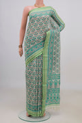 Cream Tussar Saree with Floral Print on the body and Thread Border.  displayed on a mannequin