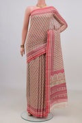 Cream Tussar Saree with Floral Print on the body and Thread Border.  displayed on a mannequin