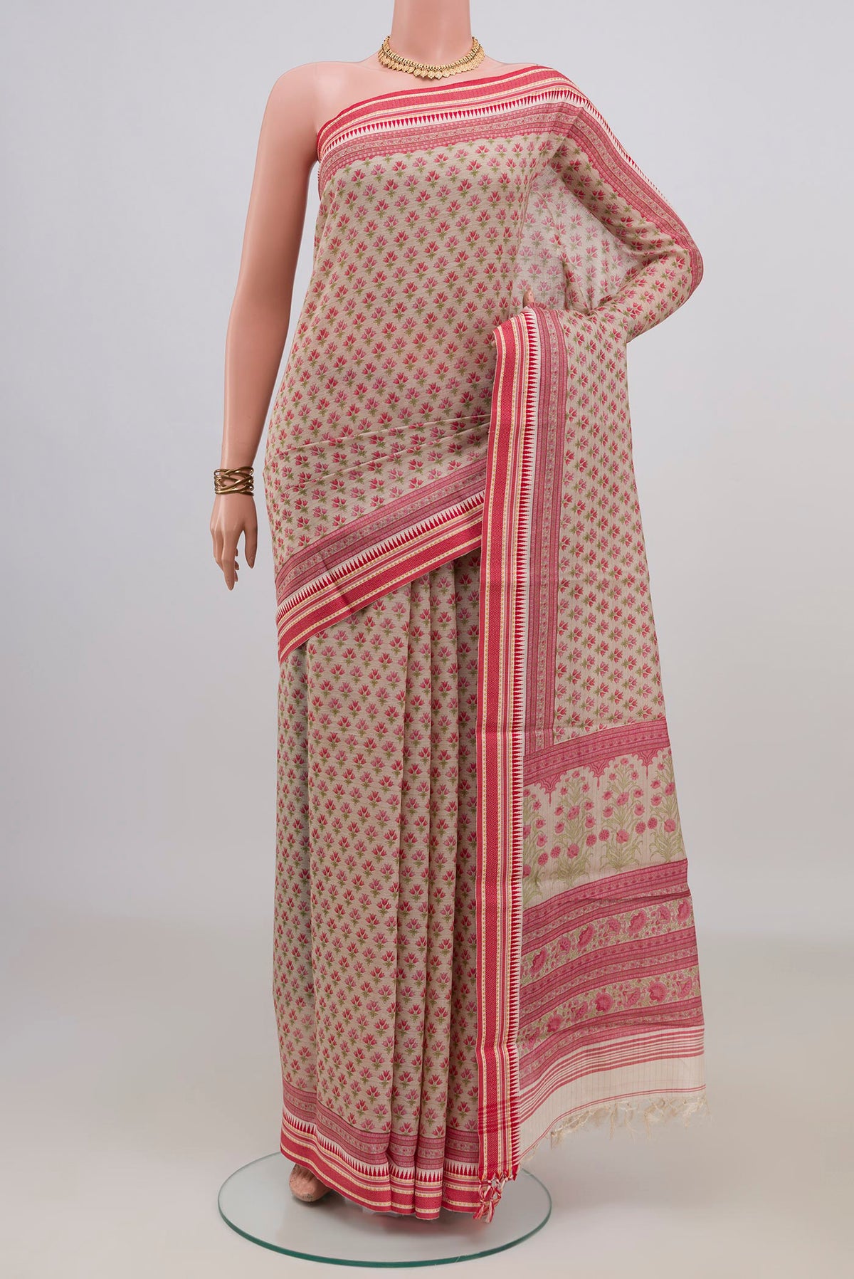Cream Tussar Saree with Floral Print on the body and Thread Border.  displayed on a mannequin
