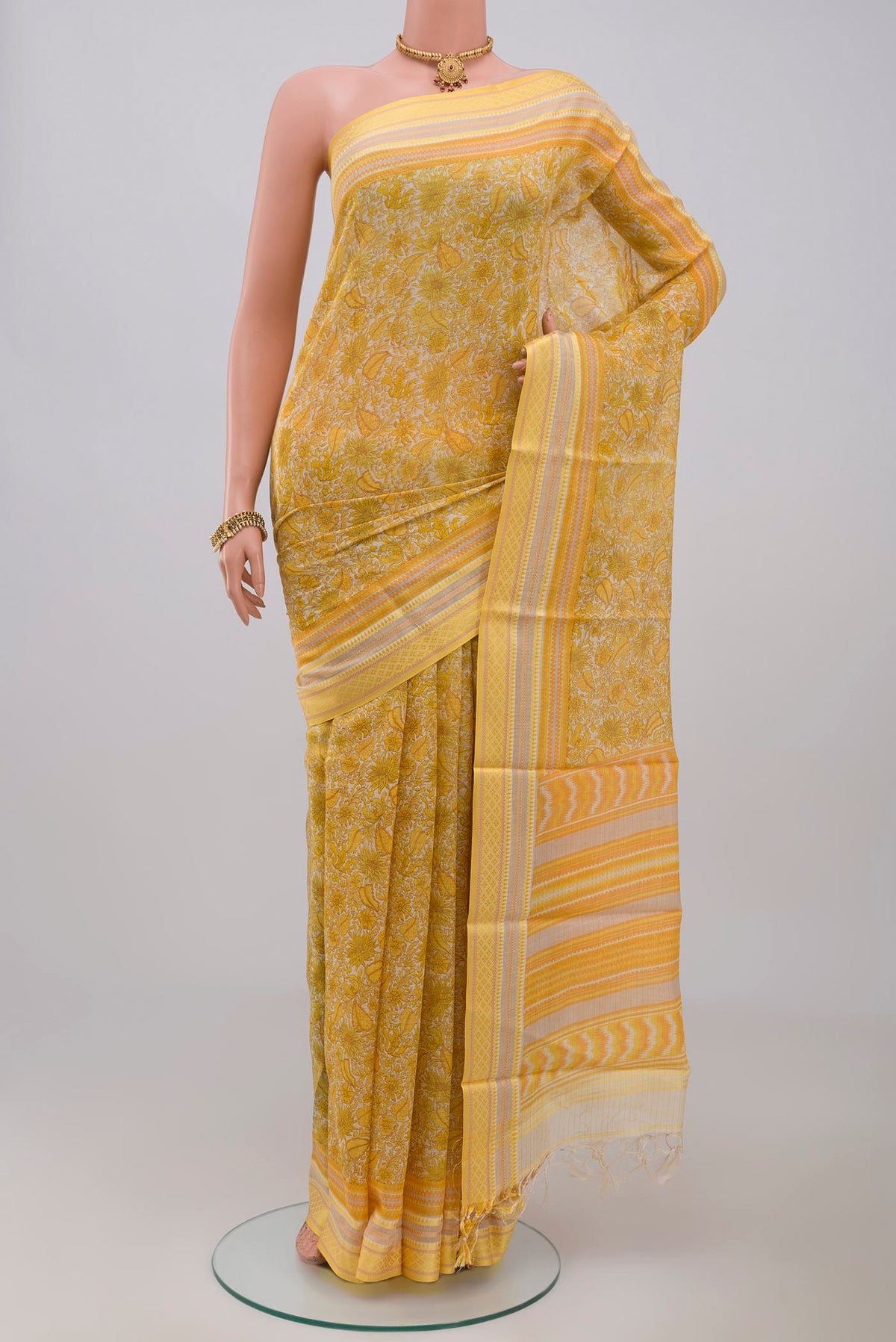 Yellow Tussar Silk Saree with Fancy on the body and Thread Border.  displayed on a mannequin