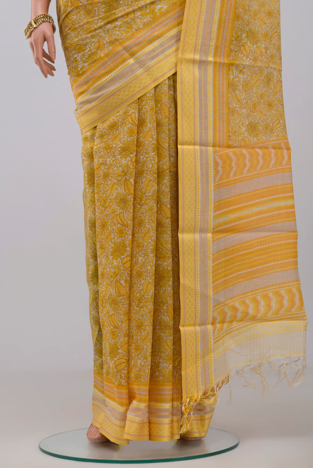 Pleats and pallu of Yellow Tussar Silk Saree with Fancy on the body and Thread Border. 