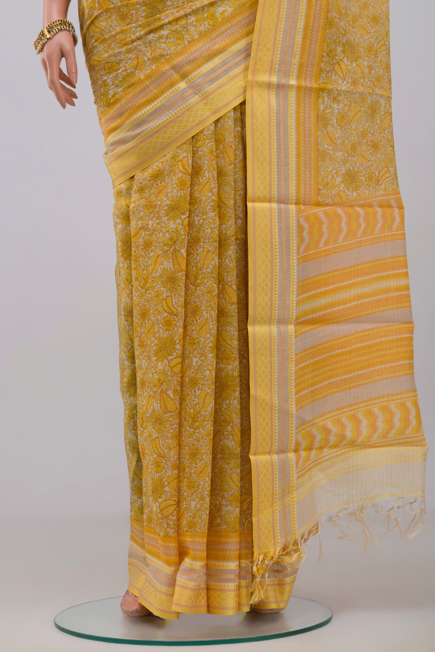 Pleats and pallu of Yellow Tussar Silk Saree with Fancy on the body and Thread Border. 