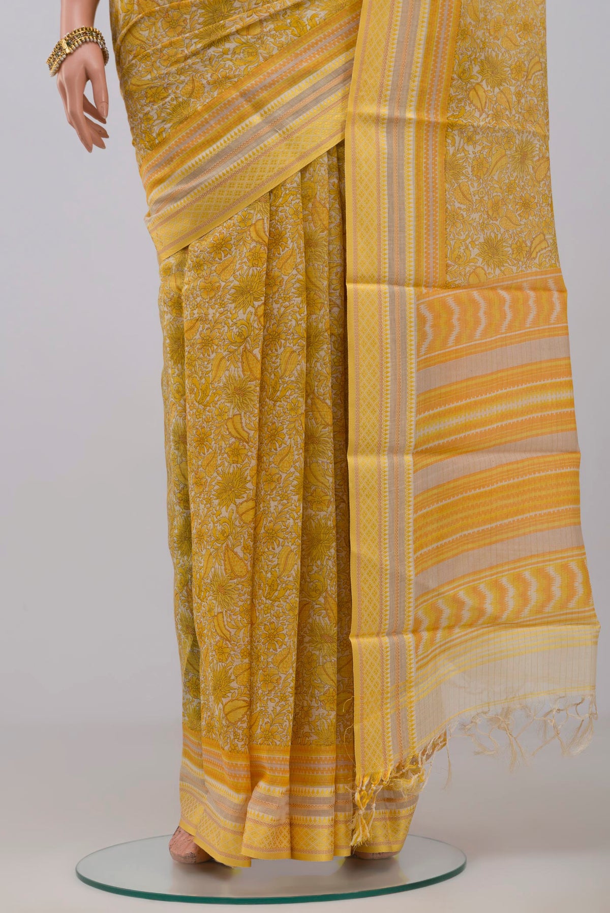 Pleats and pallu of Yellow Tussar Silk Saree with Fancy on the body and Thread Border. 