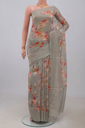 Grey Linen Saree with Floral Print on the body and Thin Zari Line.  displayed on a mannequin