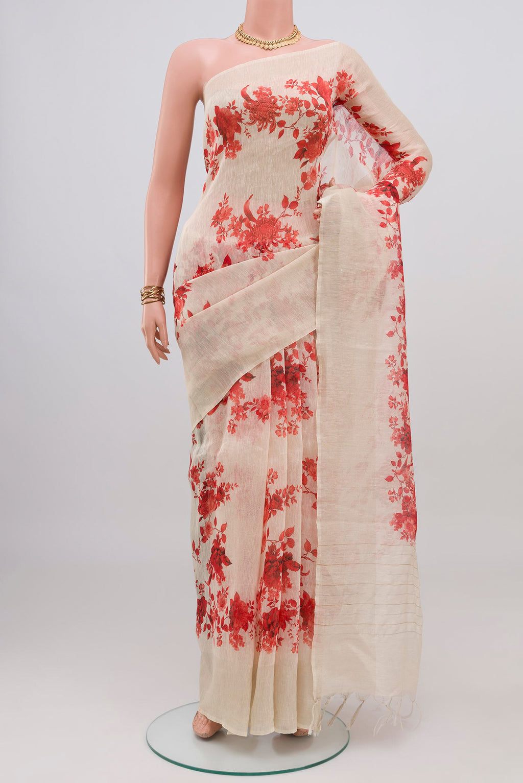 Cream Linen Saree with Floral Print on the body and Thin Zari Line.  displayed on a mannequin