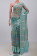 Sky Blue Kota Silk Saree with Printed design on the body and Zari Border.  displayed on a mannequin