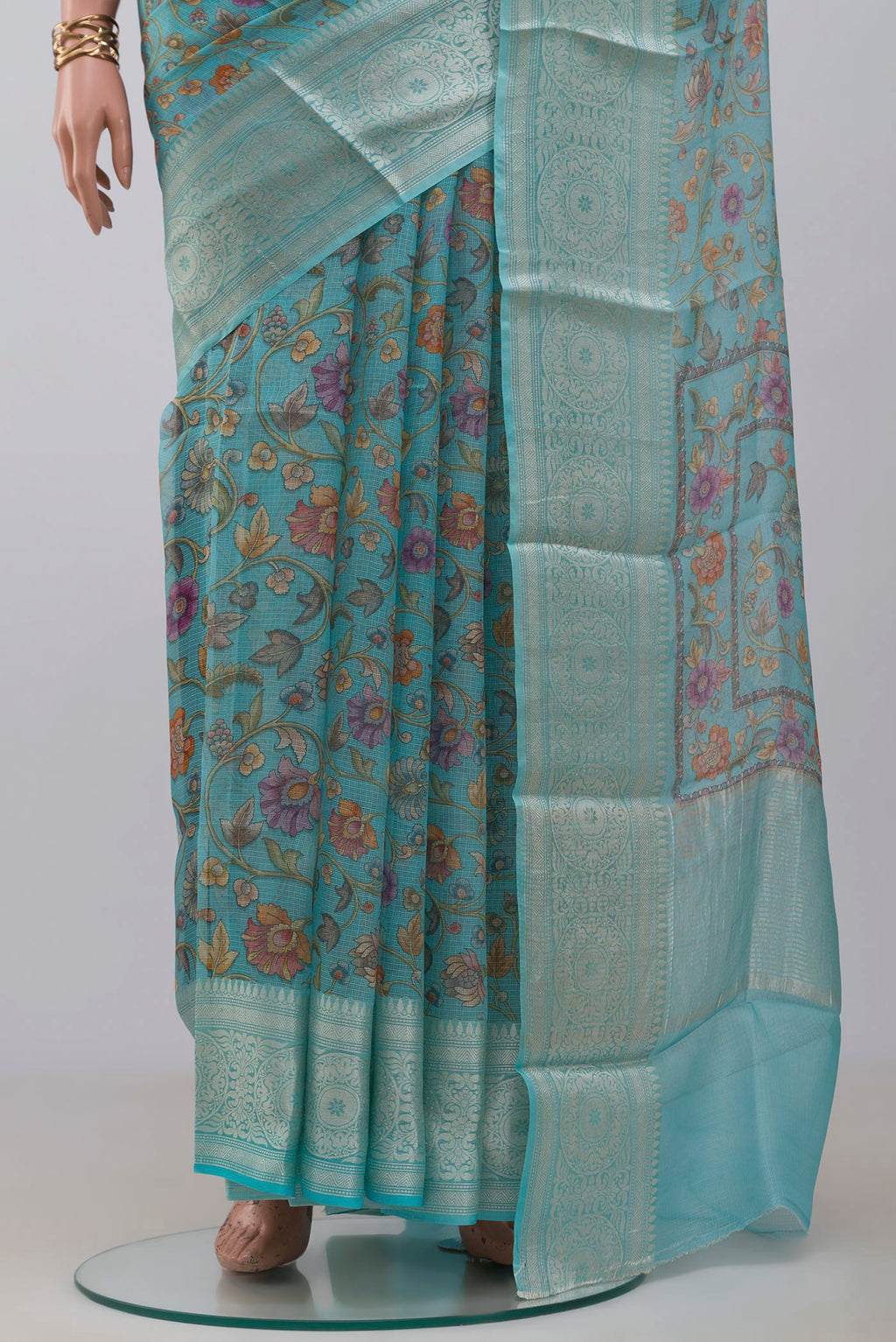 Pleats and pallu of Sky Blue Kota Silk Saree with Printed design on the body and Zari Border. 
