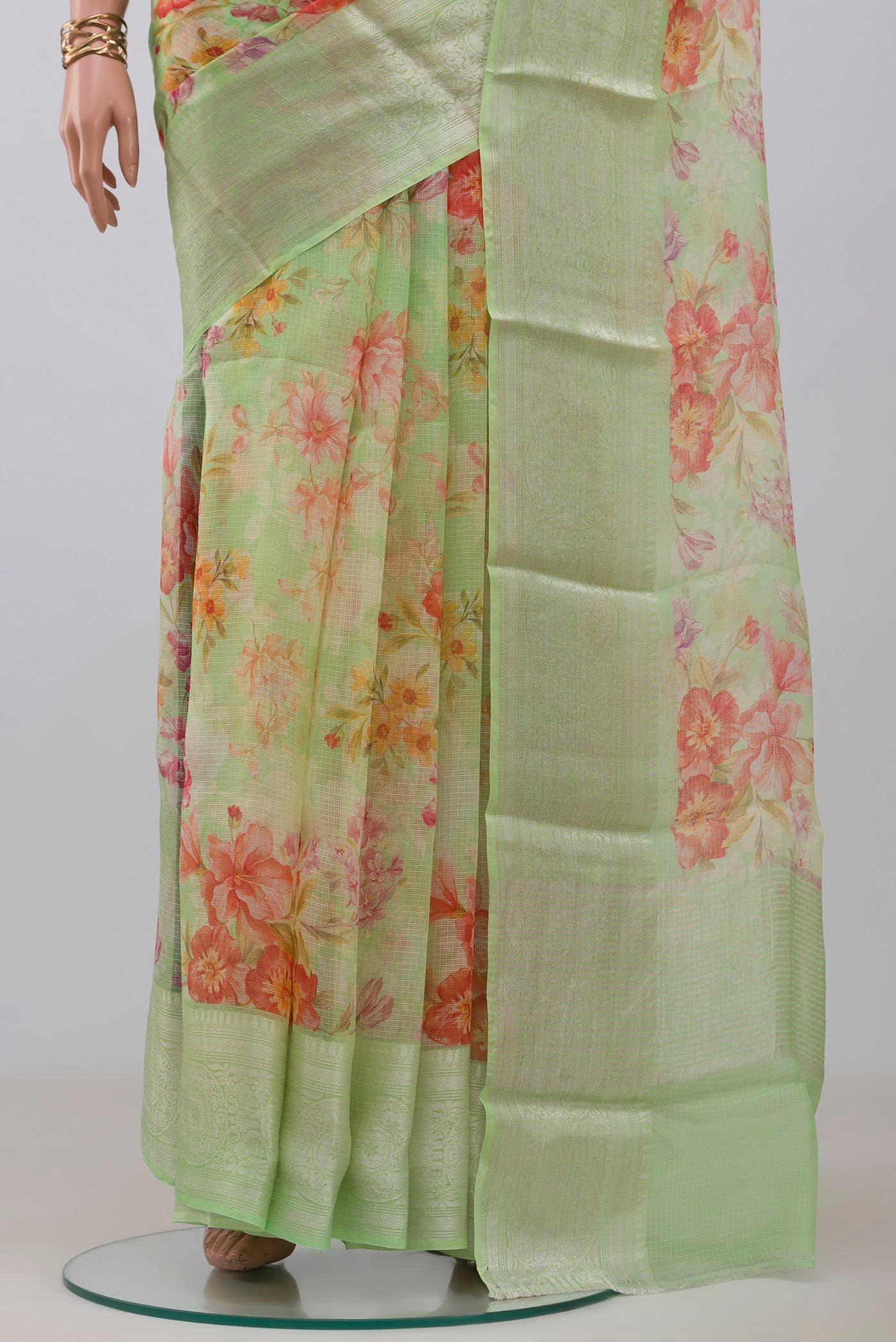 Pleats and pallu of Light Green Kota Silk Saree with Printed design on the body and Zari Border. 