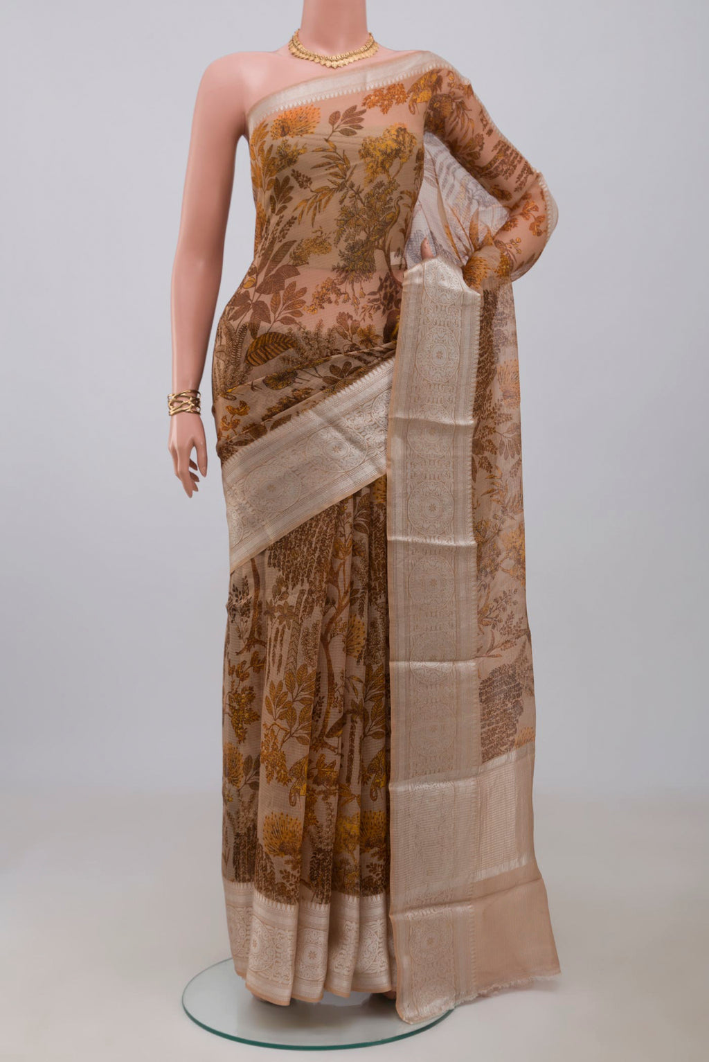 Beige Kota Silk Saree with Printed design on the body and Zari Border.  displayed on a mannequin